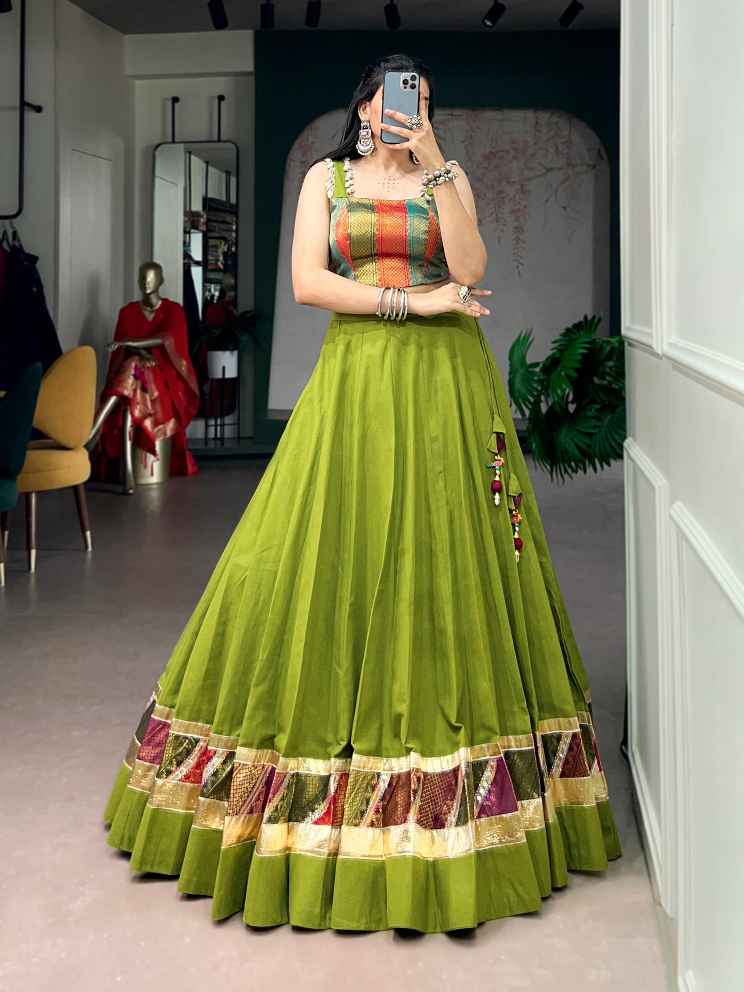 Cotton lehenga enhanced with zari weaving, embossed design work, and delicate lace touch-up.
