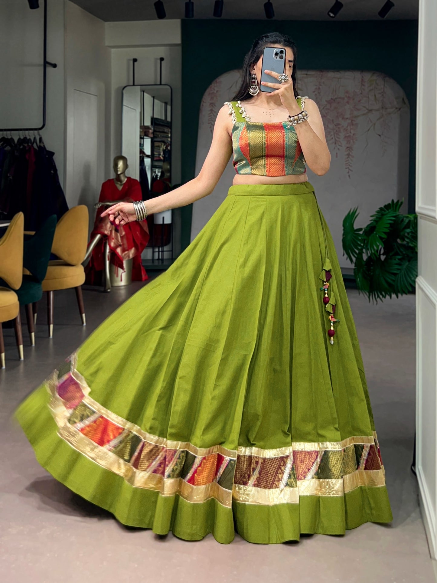 Cotton lehenga enhanced with zari weaving, embossed design work, and delicate lace touch-up.