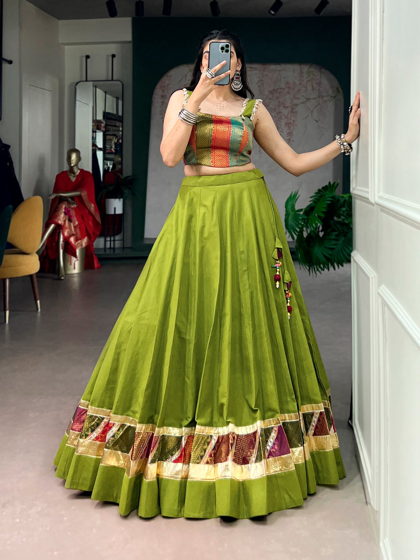Cotton lehenga enhanced with zari weaving, embossed design work, and delicate lace touch-up.