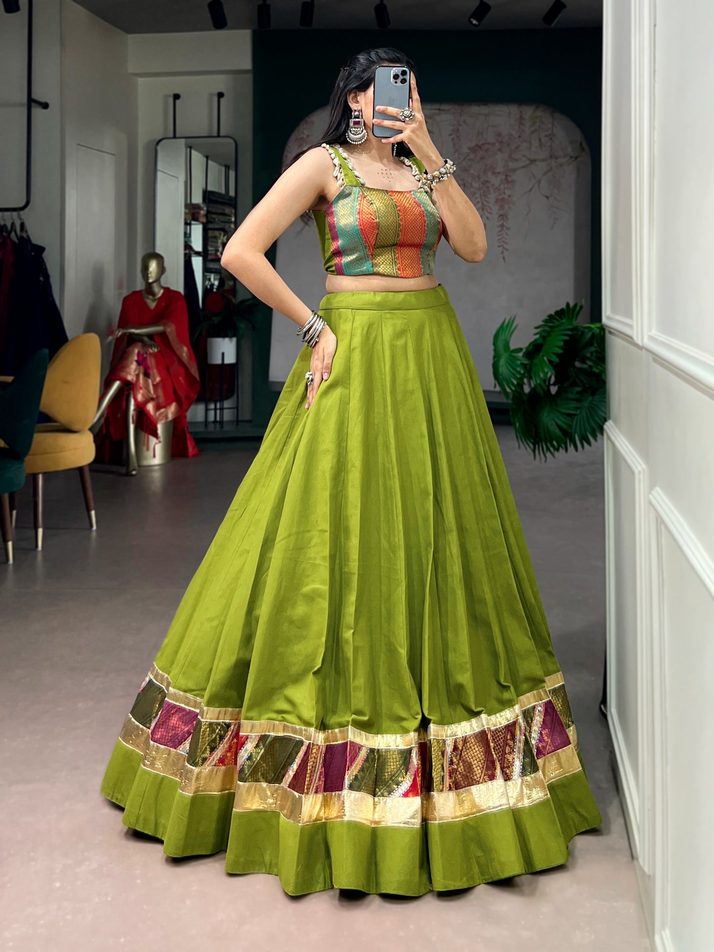 Cotton lehenga enhanced with zari weaving, embossed design work, and delicate lace touch-up.