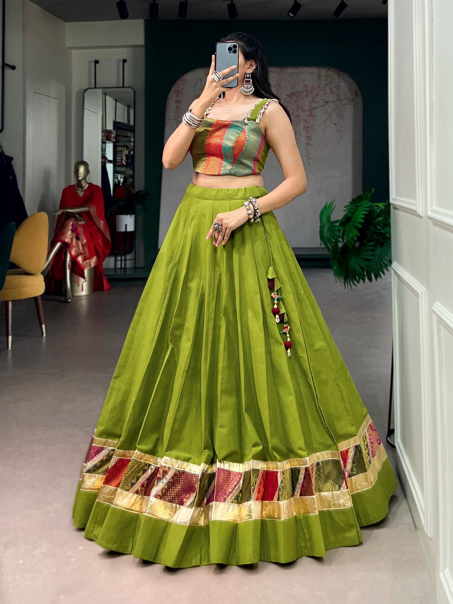 Cotton lehenga enhanced with zari weaving, embossed design work, and delicate lace touch-up.