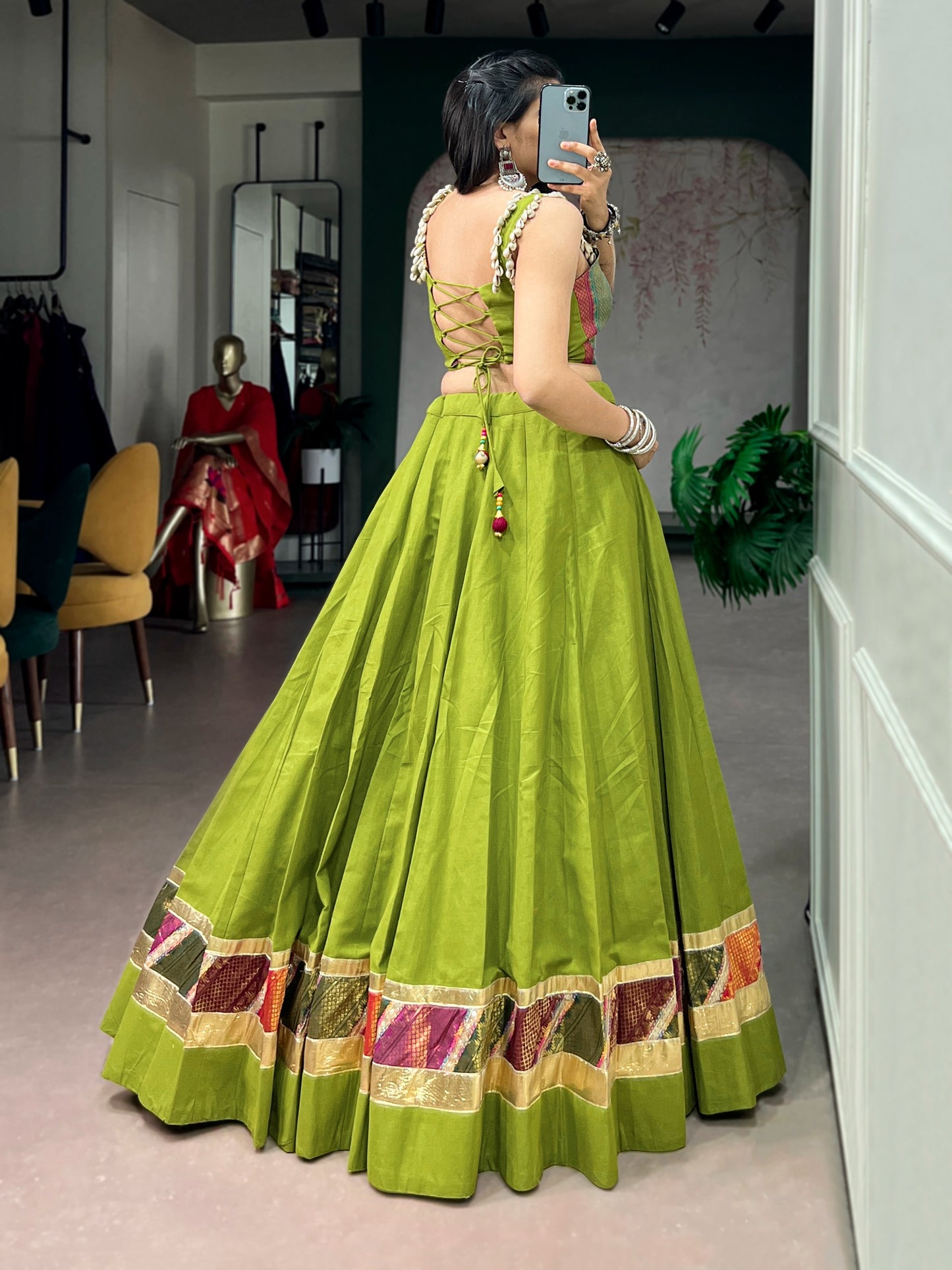 Cotton lehenga enhanced with zari weaving, embossed design work, and delicate lace touch-up.