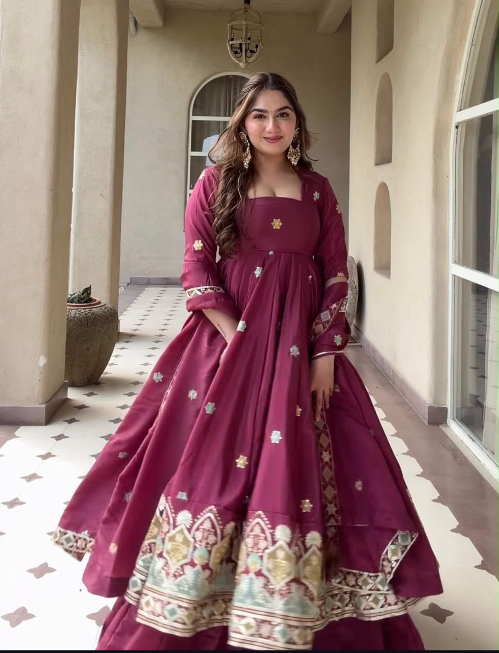A Contemporary Interpretation of Traditional Royal Anarkali Silhouettes Against Minimalist Arched Architecture