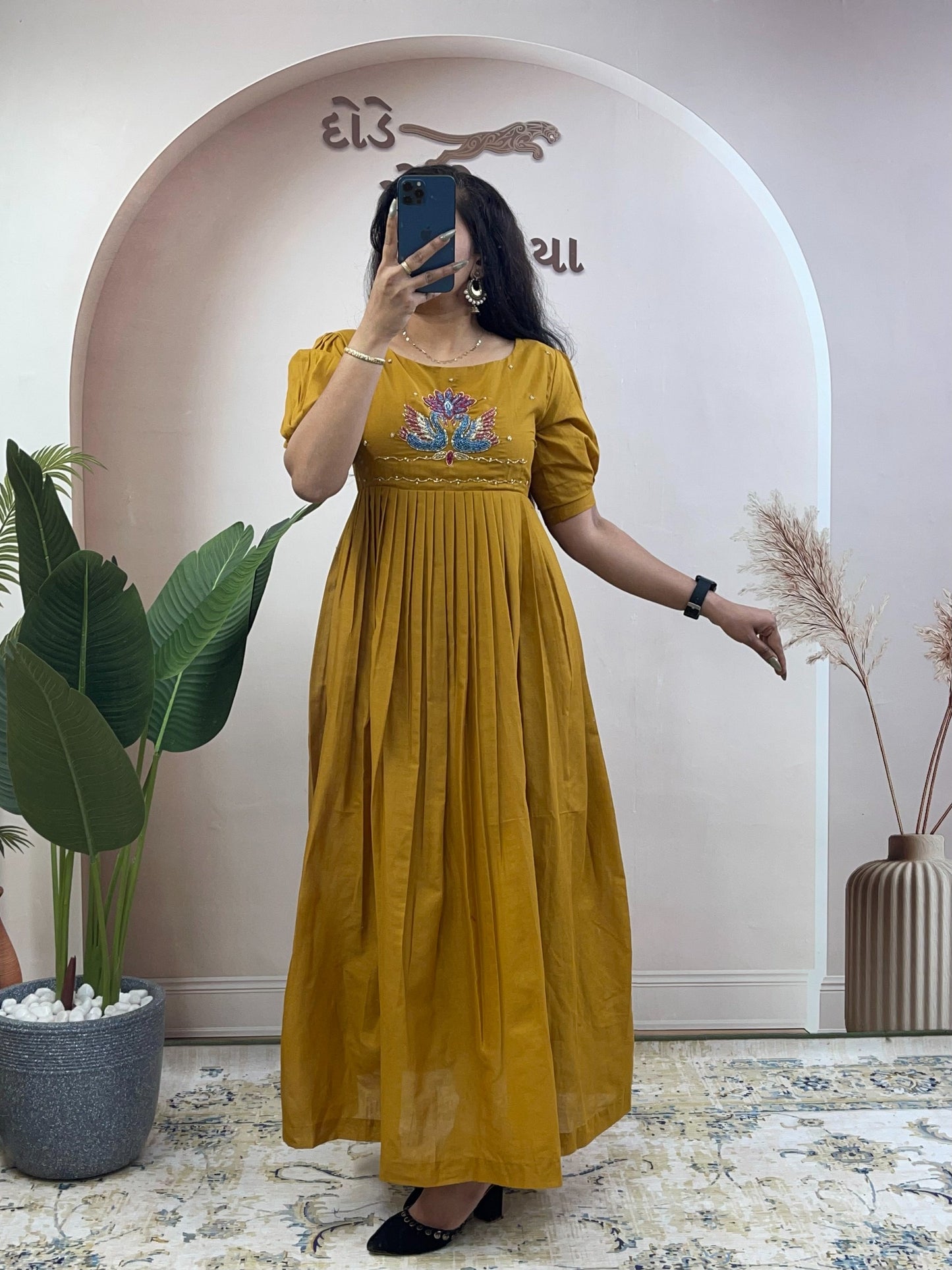 Elegant Cotton Flared Anarkali Maxi Dress with Intricate Peacock Hand Embroidery and Puff Sleeves .
