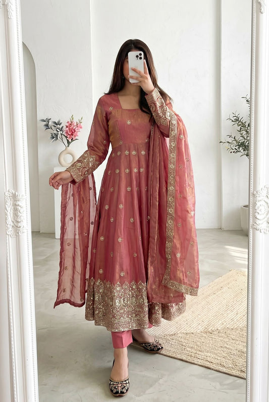 Four-Part Color Series of a Model Wearing a Flared Organza Anarkali Gown with Traditional Gold Medallion Motifs and Scalloped Border Work