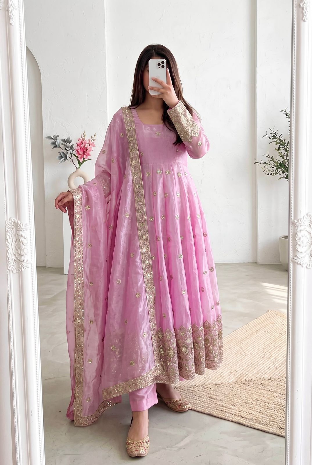Four-Part Color Series of a Model Wearing a Flared Organza Anarkali Gown with Traditional Gold Medallion Motifs and Scalloped Border Work
