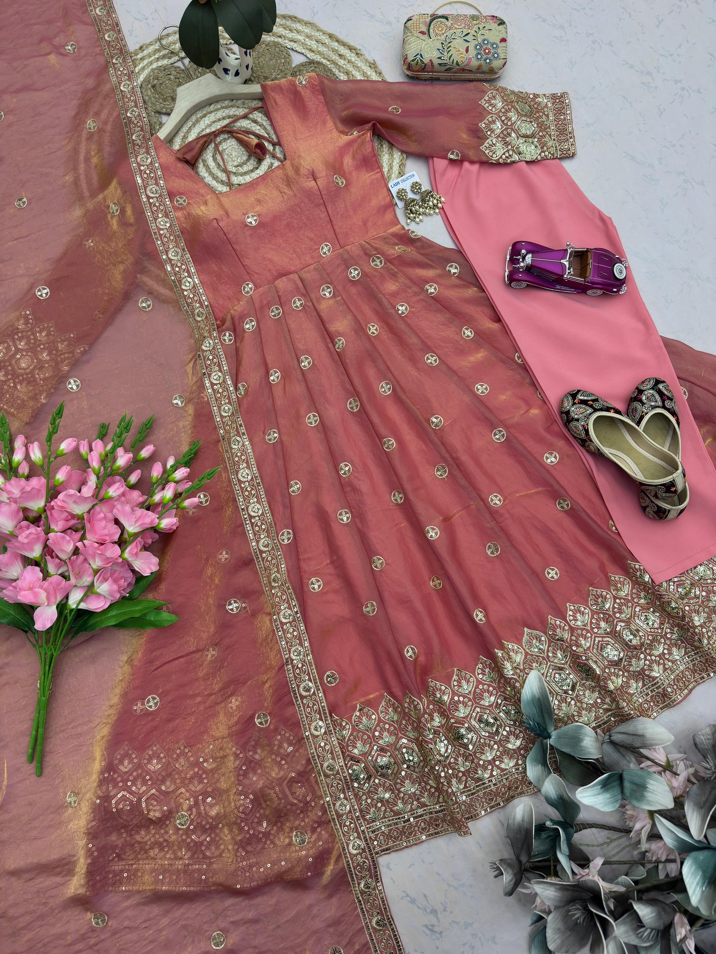 Four-Part Color Series of a Model Wearing a Flared Organza Anarkali Gown with Traditional Gold Medallion Motifs and Scalloped Border Work