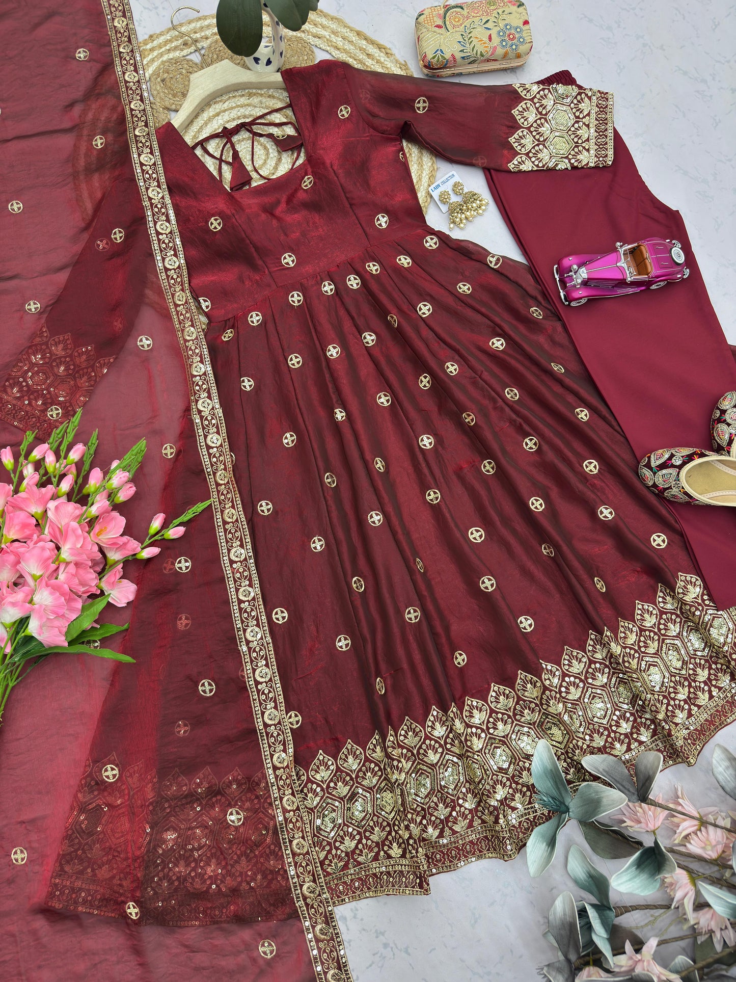 Four-Part Color Series of a Model Wearing a Flared Organza Anarkali Gown with Traditional Gold Medallion Motifs and Scalloped Border Work