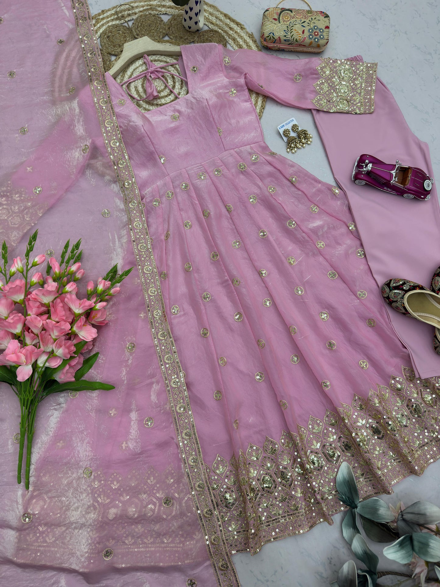 Four-Part Color Series of a Model Wearing a Flared Organza Anarkali Gown with Traditional Gold Medallion Motifs and Scalloped Border Work