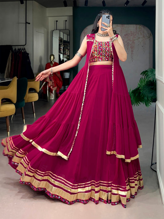 Comfort with this lightweight lehenga, highlighted by a handcrafted Gamthi blouse, Gotta Patti lace detailing, and a mirror-adorned long koti.