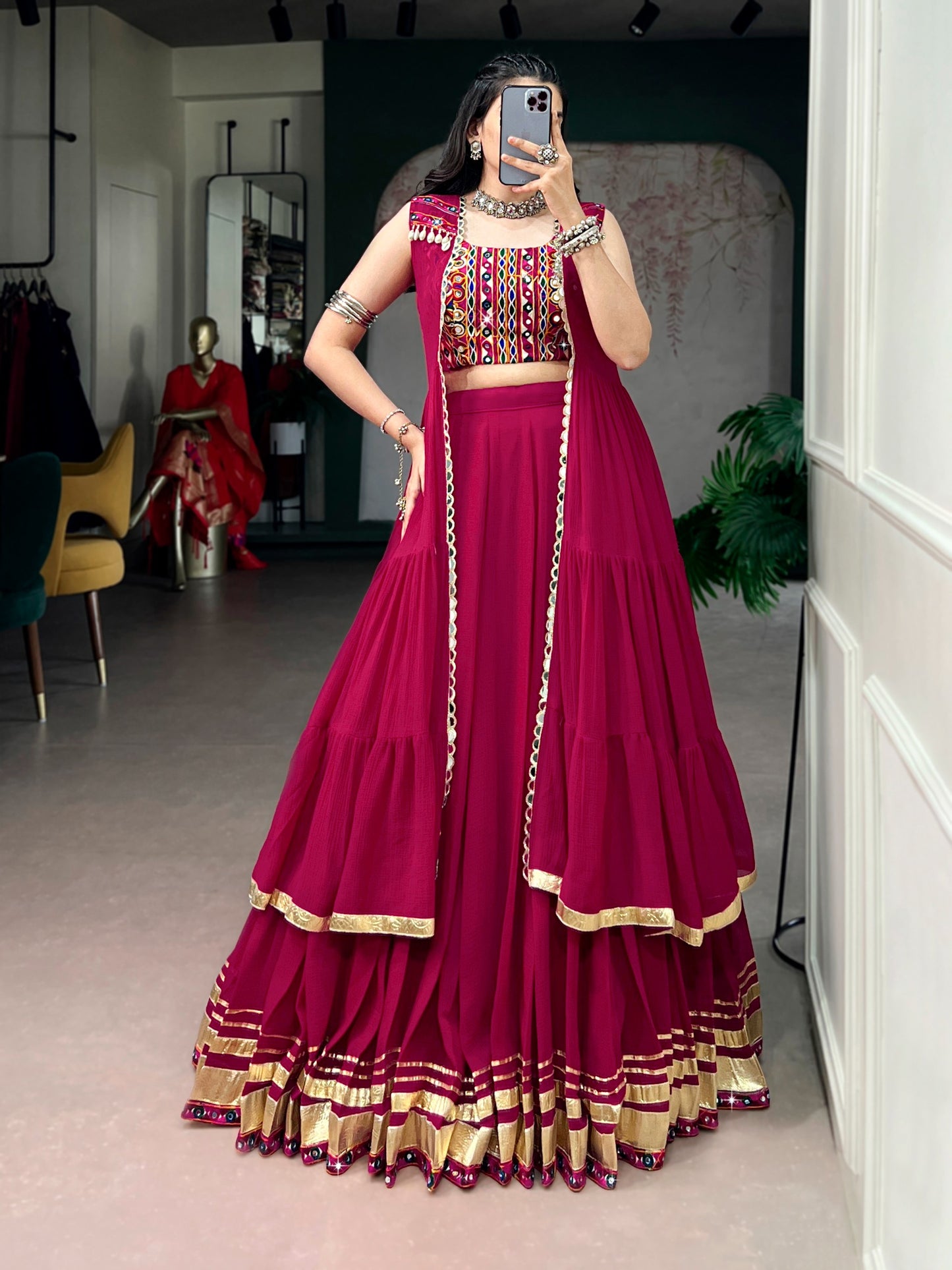 Comfort with this lightweight lehenga, highlighted by a handcrafted Gamthi blouse, Gotta Patti lace detailing, and a mirror-adorned long koti.
