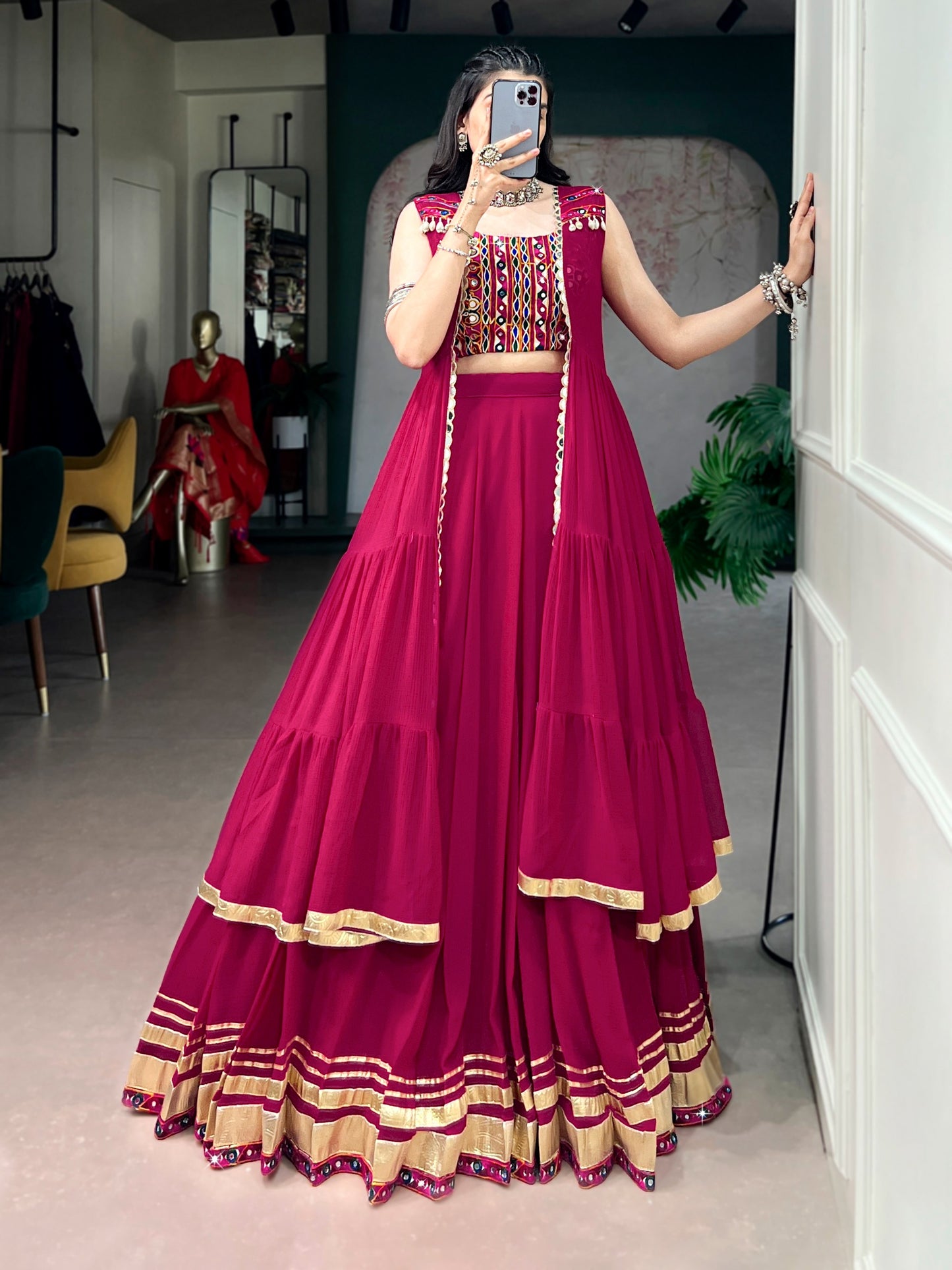 Comfort with this lightweight lehenga, highlighted by a handcrafted Gamthi blouse, Gotta Patti lace detailing, and a mirror-adorned long koti.