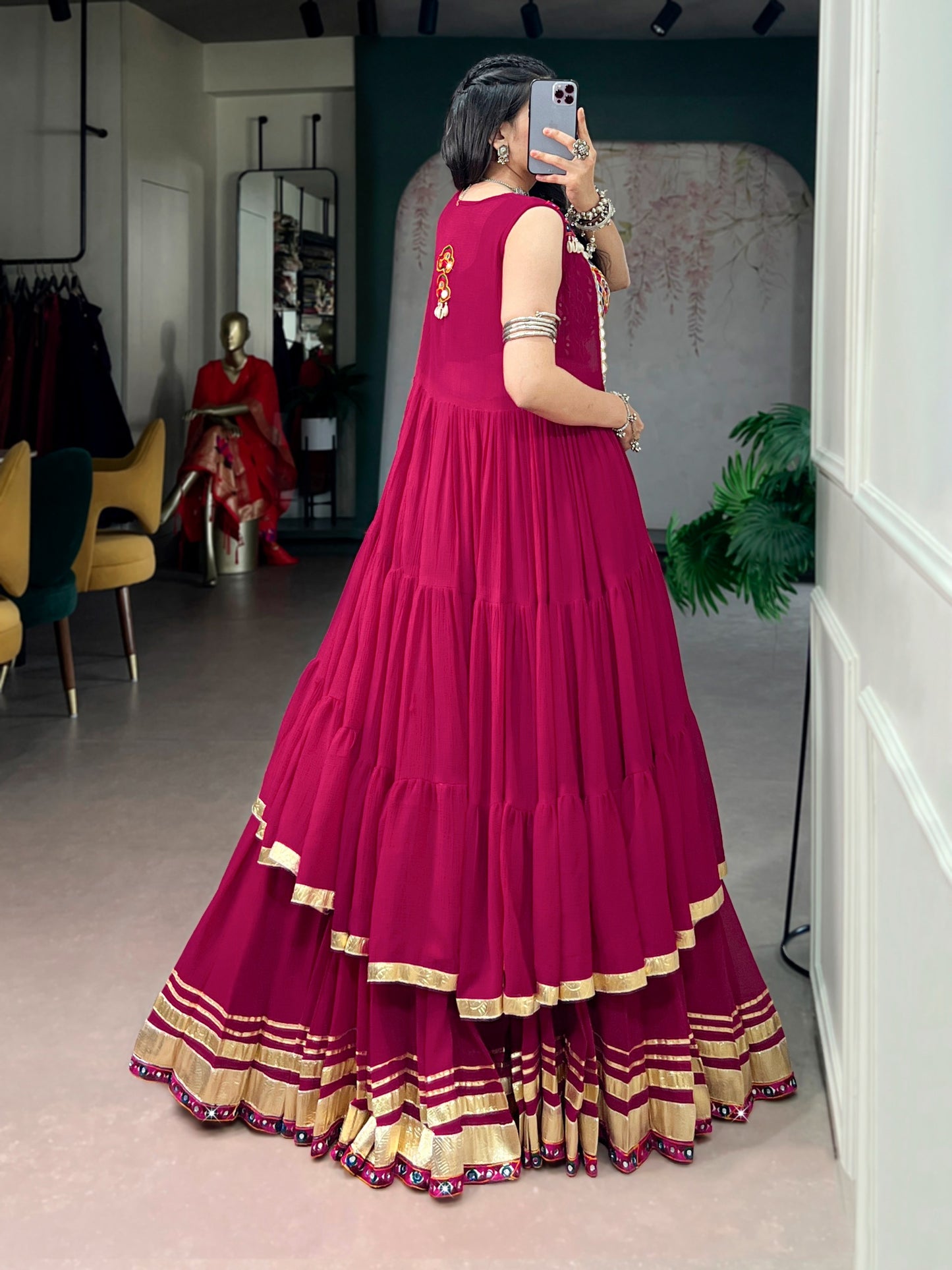 Comfort with this lightweight lehenga, highlighted by a handcrafted Gamthi blouse, Gotta Patti lace detailing, and a mirror-adorned long koti.