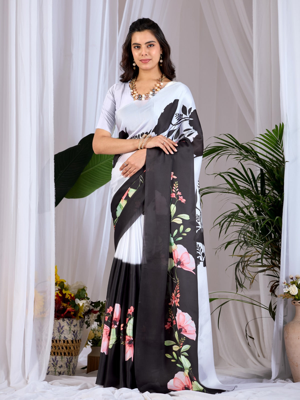 The Drama of Contrast: Framing Bold Black-and-White Silk Block Patterns with Delicate Coral Floral Clusters