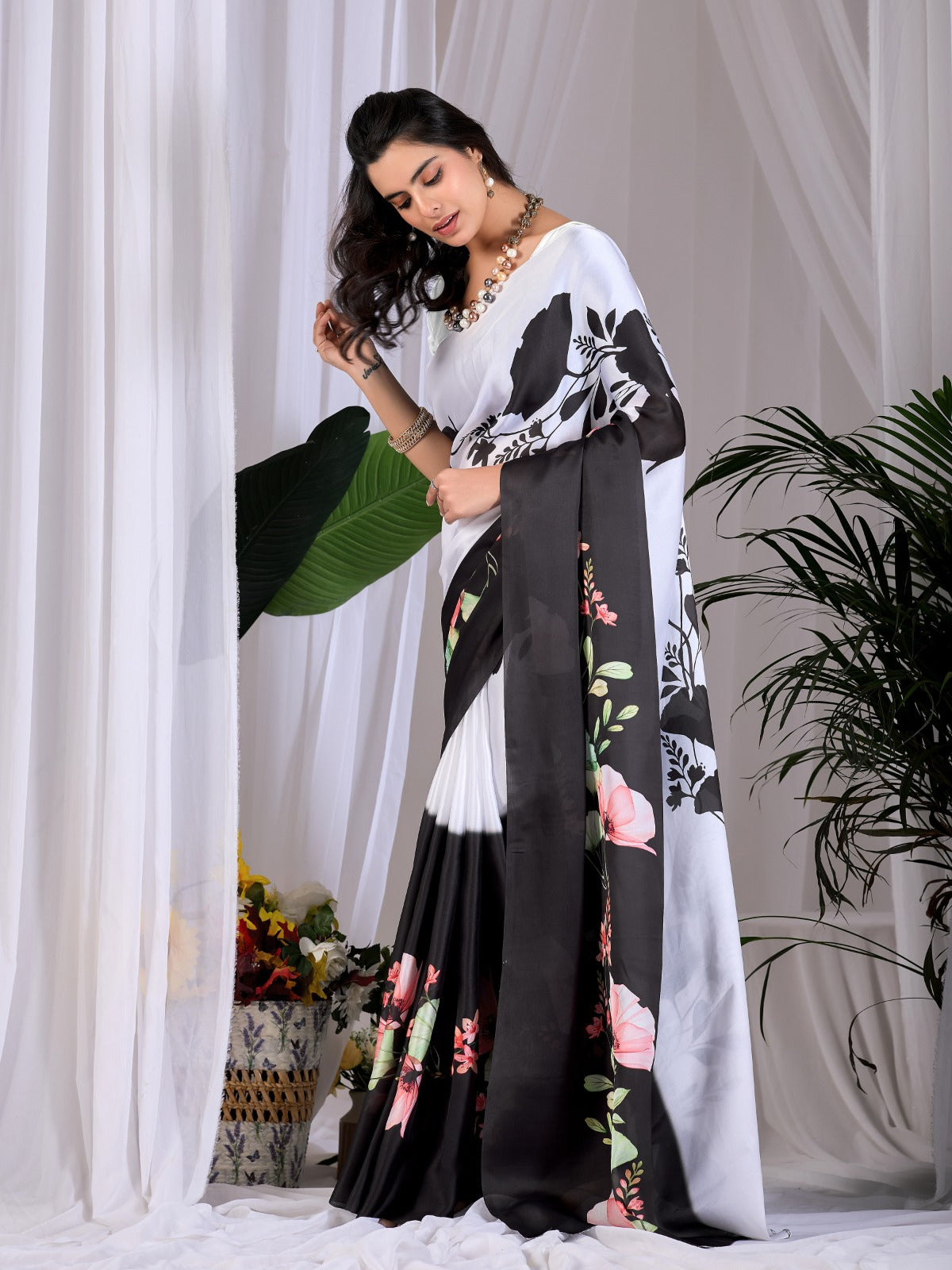 The Drama of Contrast: Framing Bold Black-and-White Silk Block Patterns with Delicate Coral Floral Clusters