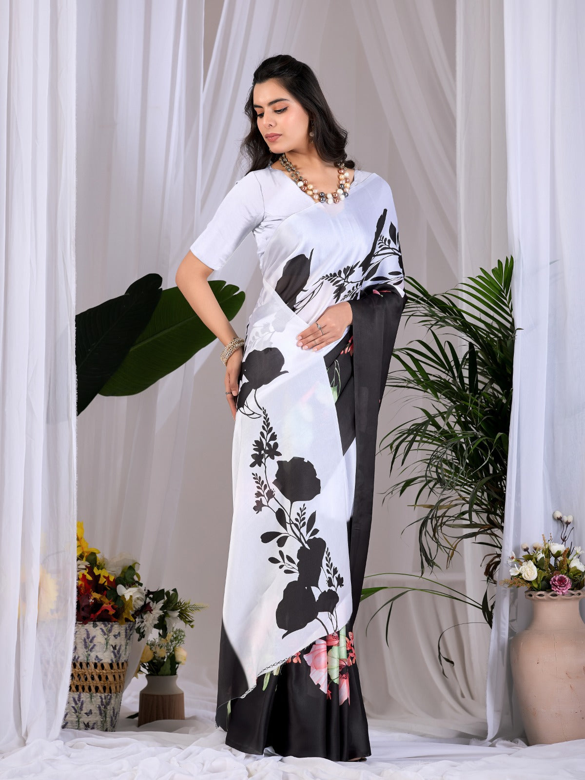 The Drama of Contrast: Framing Bold Black-and-White Silk Block Patterns with Delicate Coral Floral Clusters