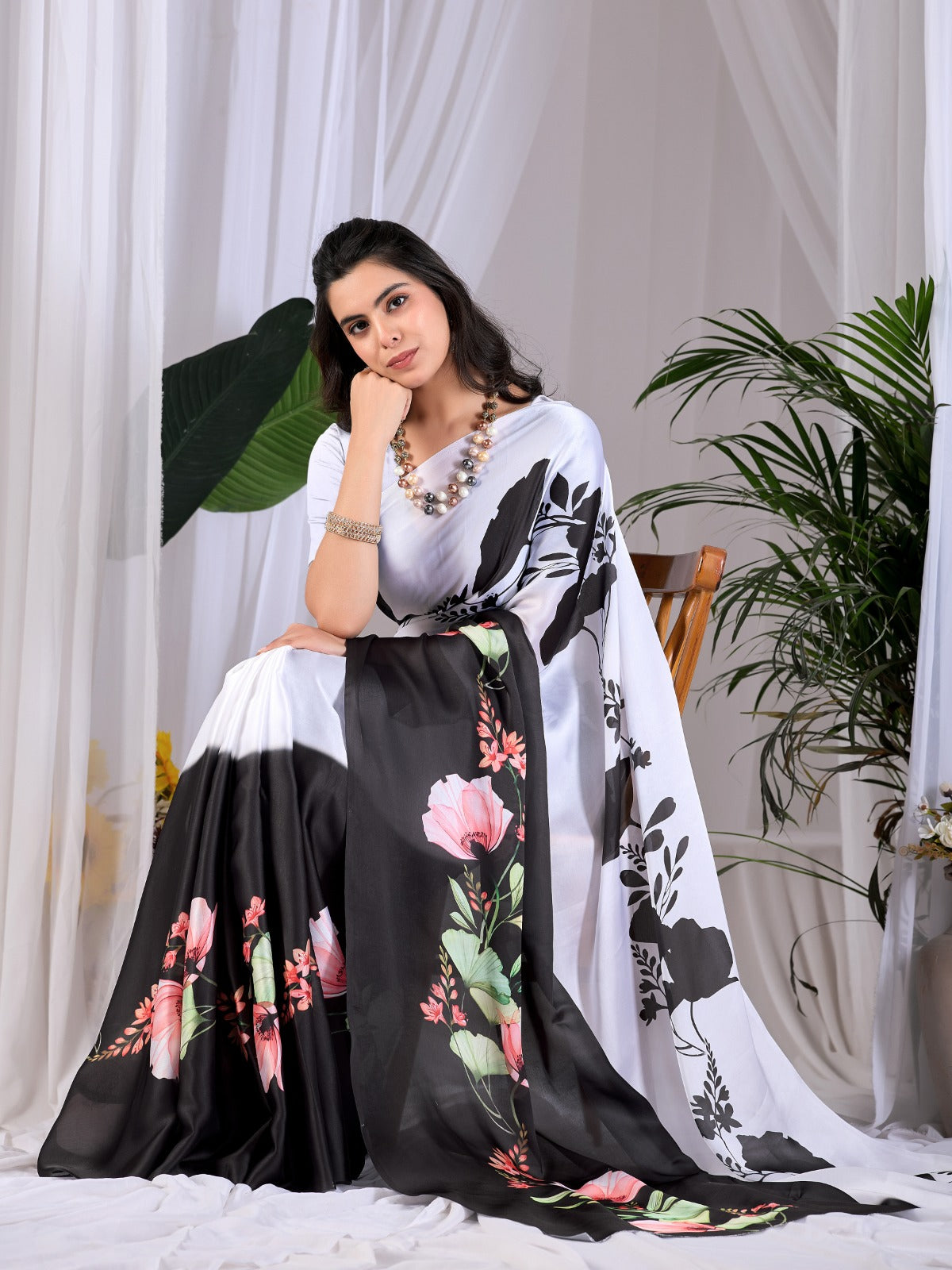 The Drama of Contrast: Framing Bold Black-and-White Silk Block Patterns with Delicate Coral Floral Clusters