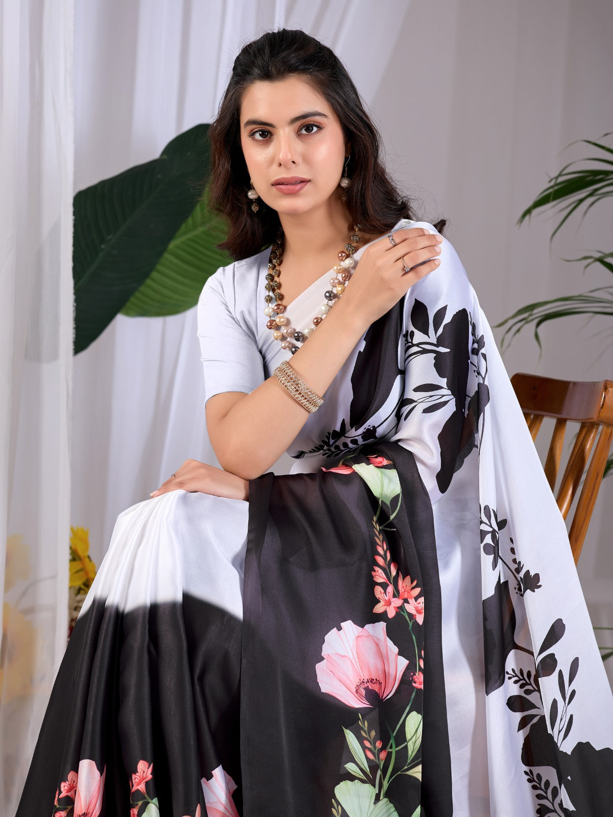 The Drama of Contrast: Framing Bold Black-and-White Silk Block Patterns with Delicate Coral Floral Clusters