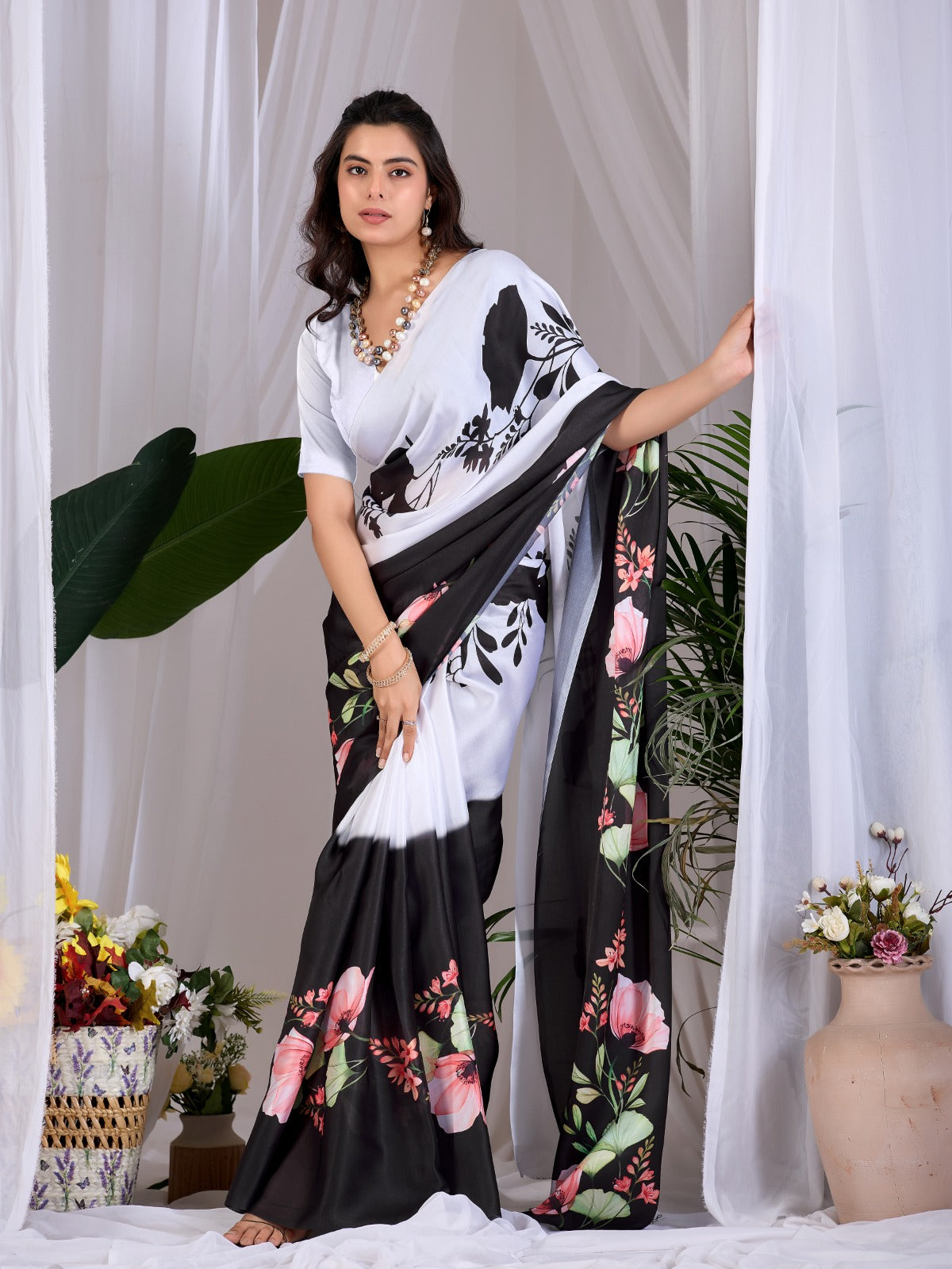 The Drama of Contrast: Framing Bold Black-and-White Silk Block Patterns with Delicate Coral Floral Clusters