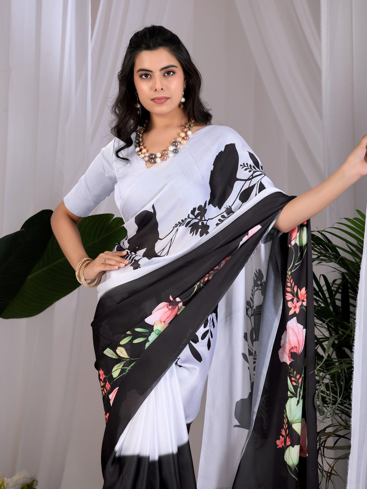 The Drama of Contrast: Framing Bold Black-and-White Silk Block Patterns with Delicate Coral Floral Clusters