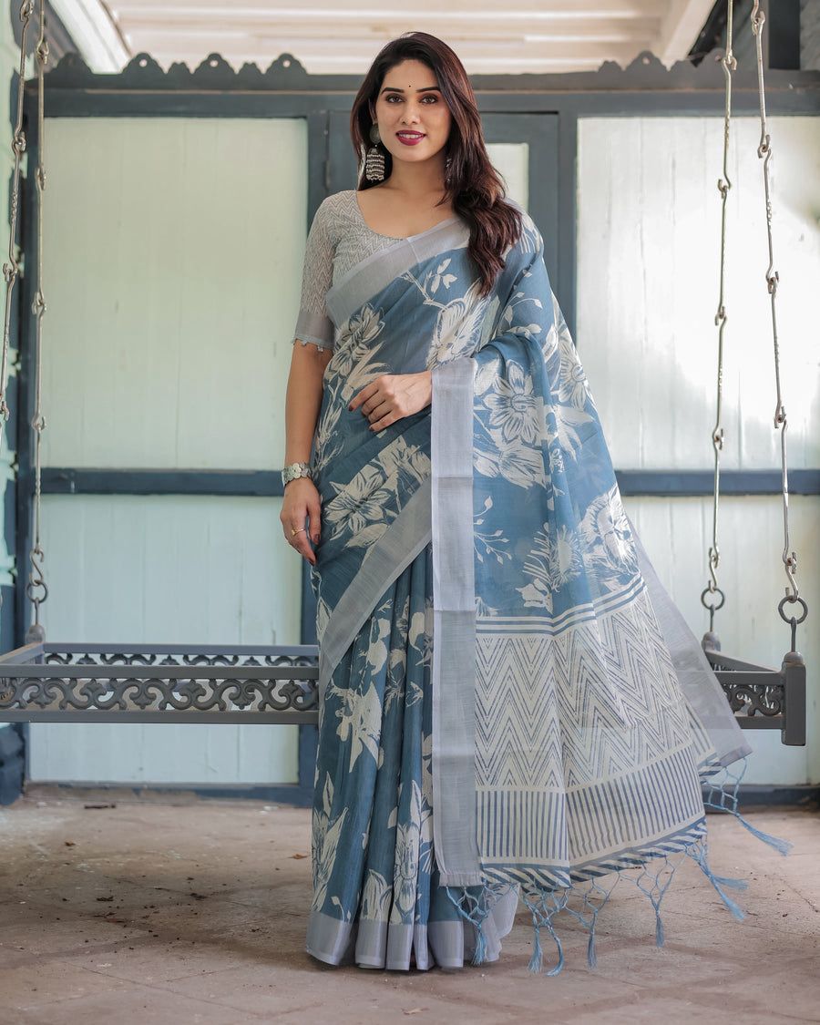 Elegant Slate Blue Mulmul Cotton Saree featuring Large Ivory Floral Block Prints, Geometric Pallu Details, and a Coordinating Textured Silver-Gray Blouse