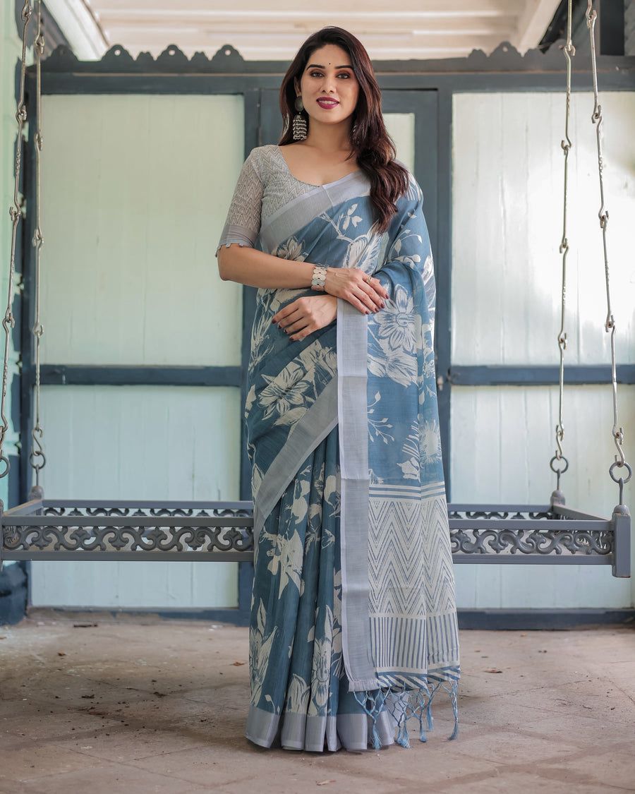 Elegant Slate Blue Mulmul Cotton Saree featuring Large Ivory Floral Block Prints, Geometric Pallu Details, and a Coordinating Textured Silver-Gray Blouse