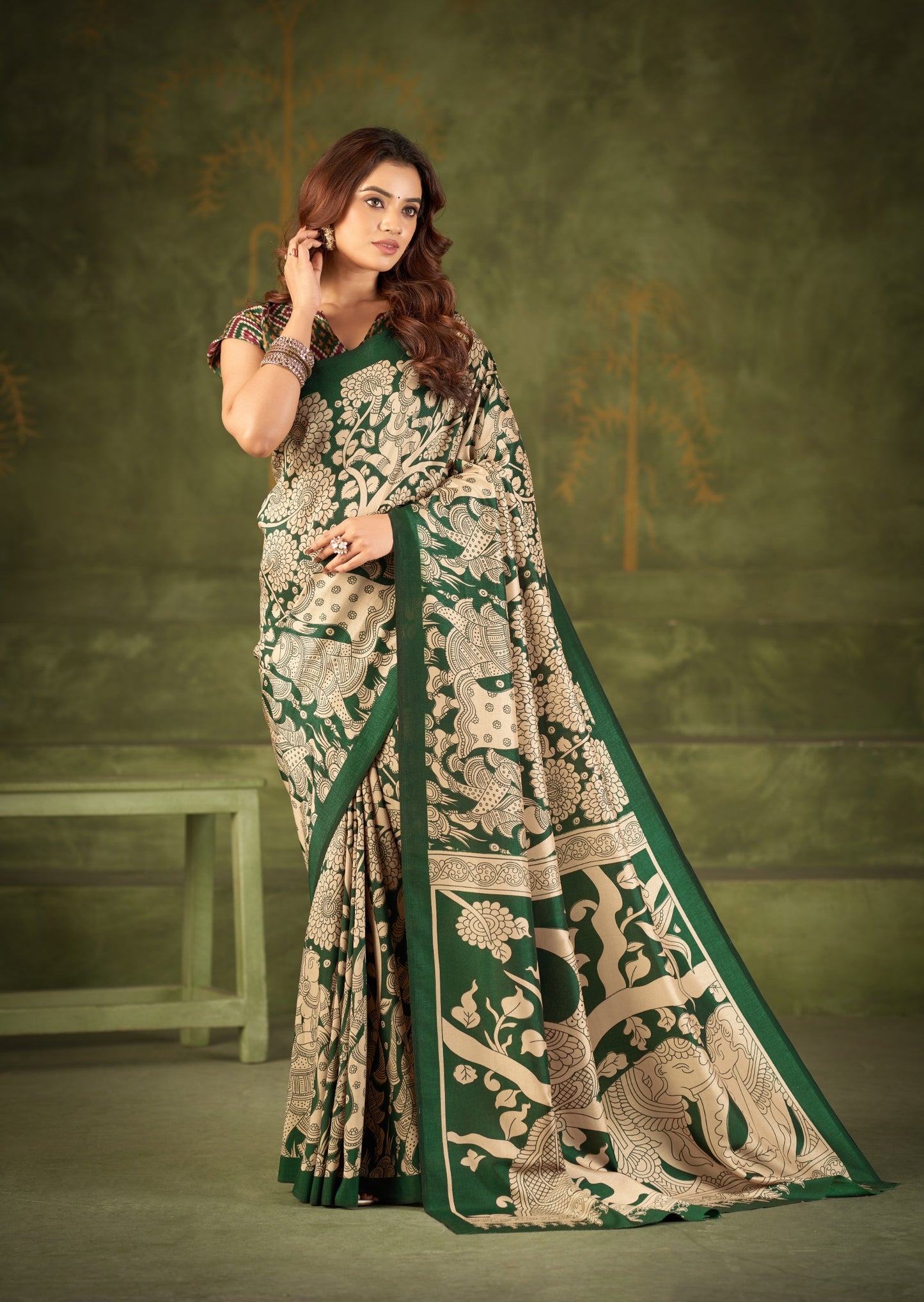 Experience the beauty of traditional Kalamkari prints on luxurious Tasar Silk, enhanced with a unique Ikkat print blouse for a sophisticated look ✨