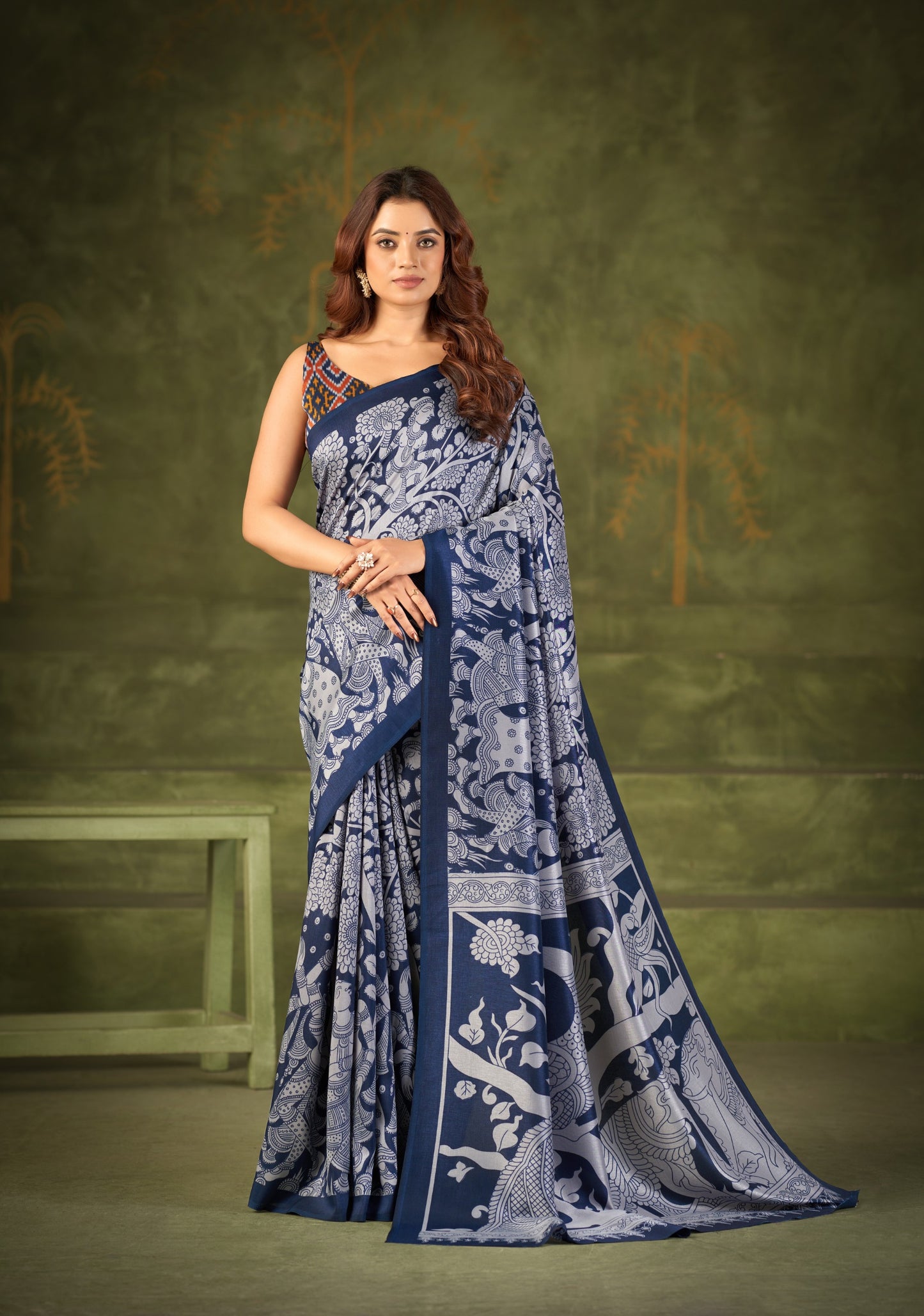 Experience the beauty of traditional Kalamkari prints on luxurious Tasar Silk, enhanced with a unique Ikkat print blouse for a sophisticated look ✨