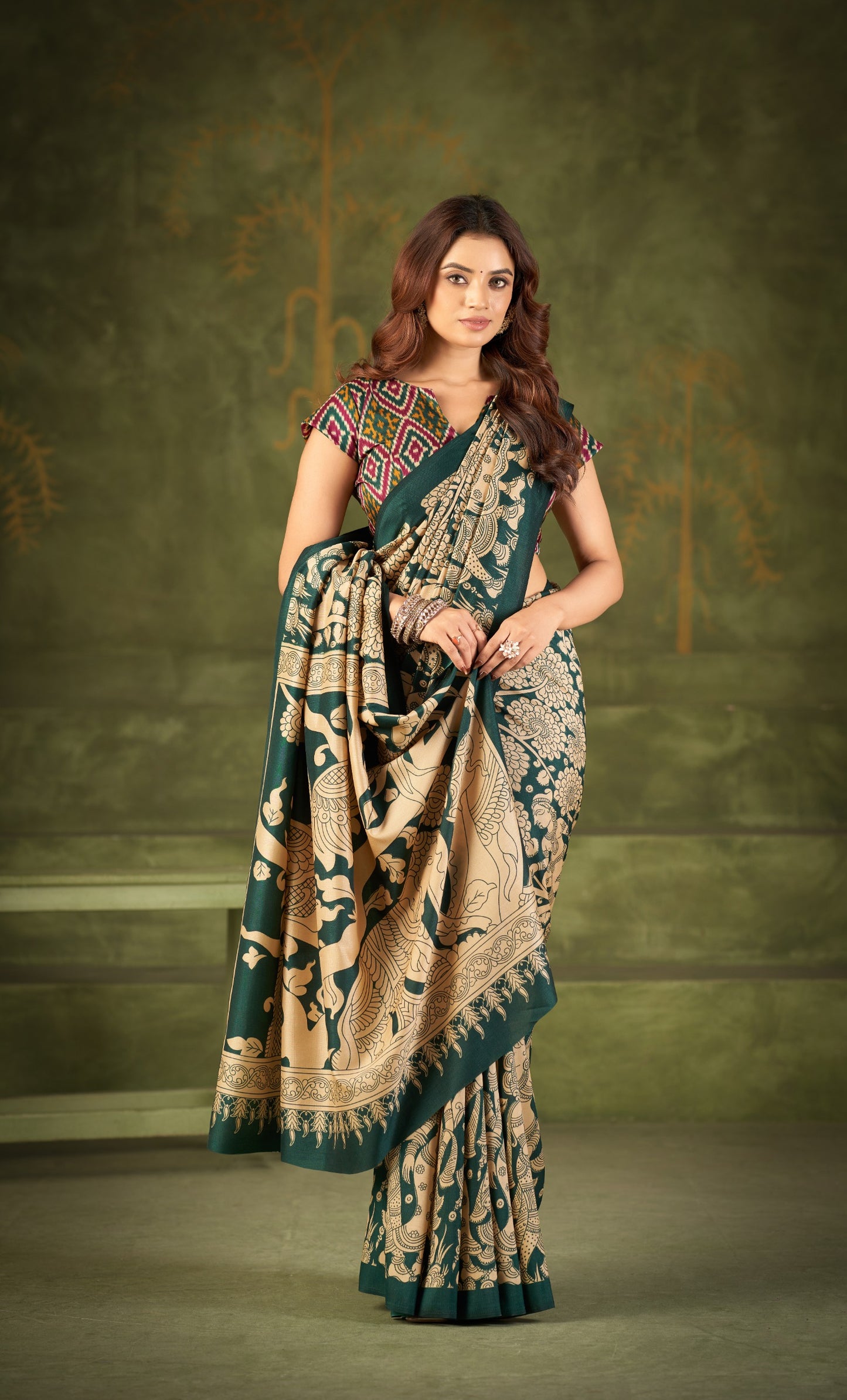 Experience the beauty of traditional Kalamkari prints on luxurious Tasar Silk, enhanced with a unique Ikkat print blouse for a sophisticated look ✨