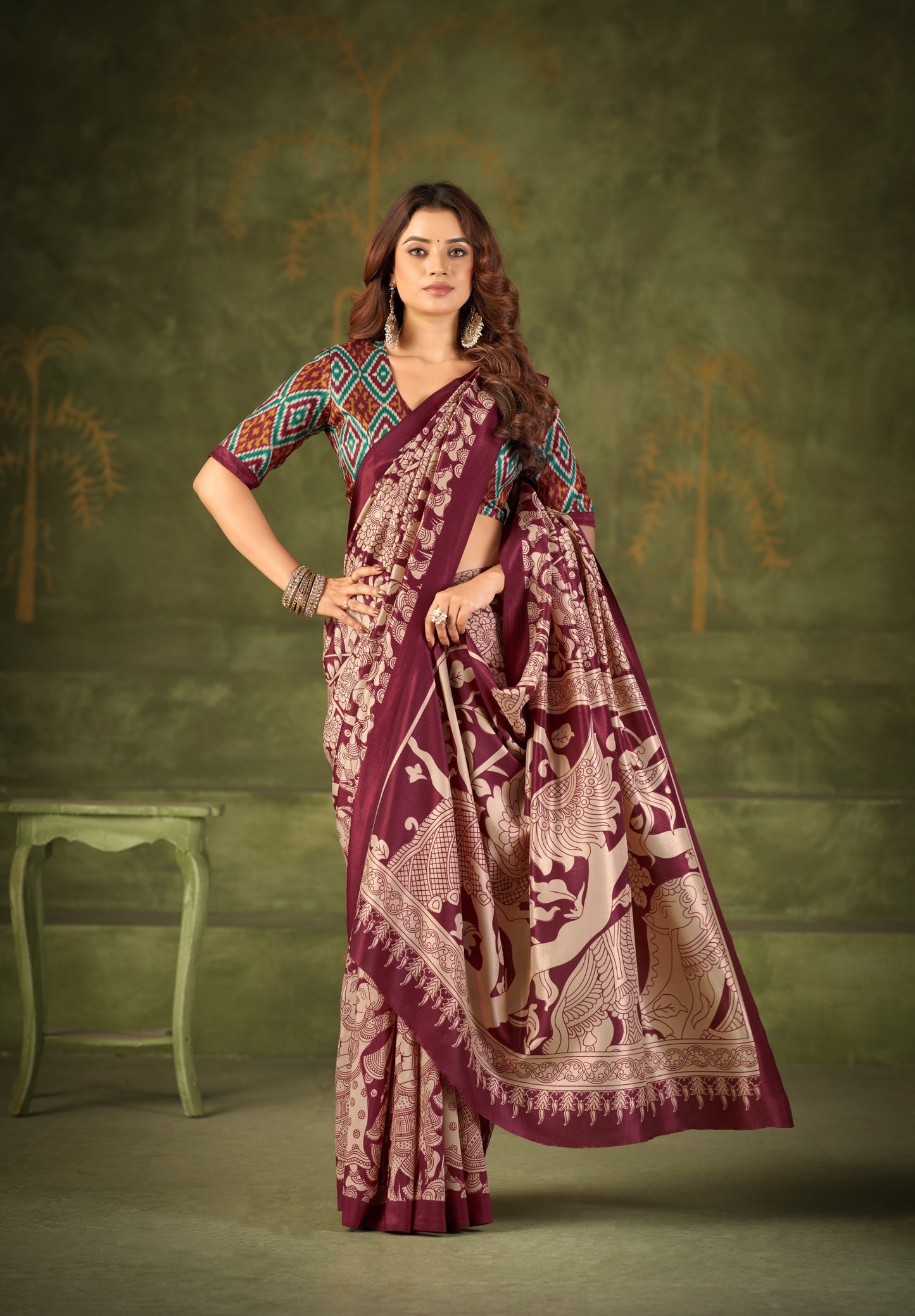 Experience the beauty of traditional Kalamkari prints on luxurious Tasar Silk, enhanced with a unique Ikkat print blouse for a sophisticated look ✨