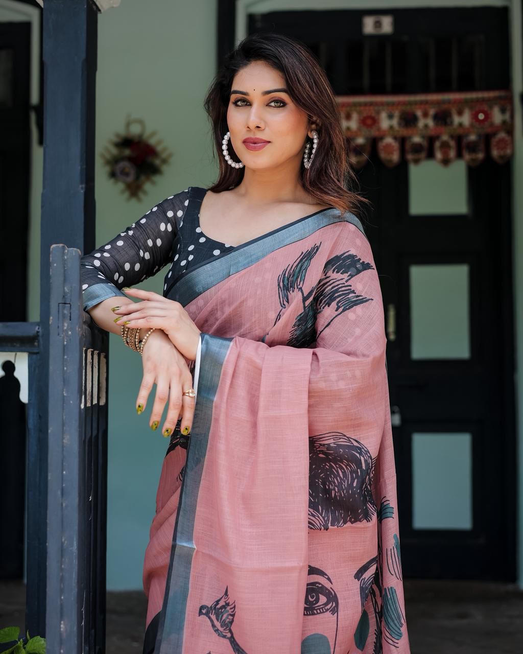 Artistic Salmon Pink Cotton Linen Saree featuring Charcoal Black Bird Sketch Illustrations, a Solid Slate Gray Border, and a Matching Polka-Dotted Blouse