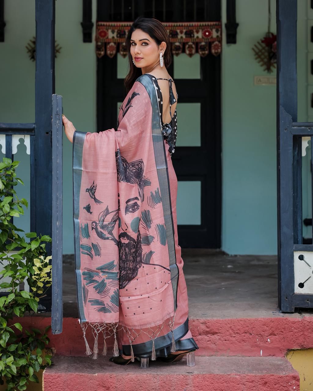 Artistic Salmon Pink Cotton Linen Saree featuring Charcoal Black Bird Sketch Illustrations, a Solid Slate Gray Border, and a Matching Polka-Dotted Blouse
