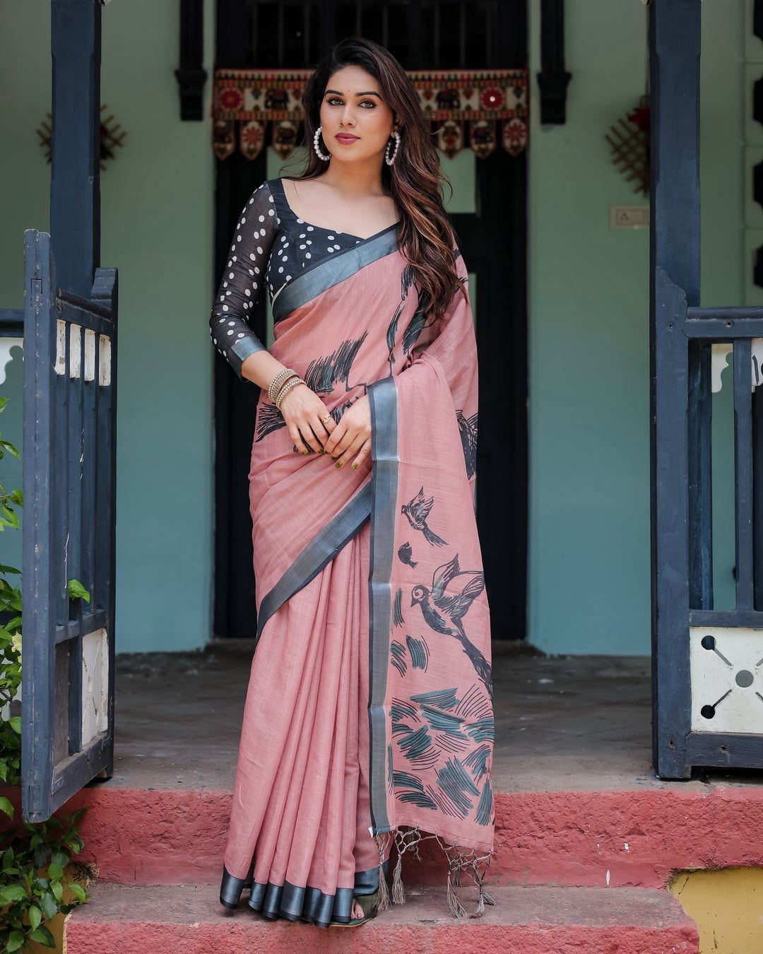 Artistic Salmon Pink Cotton Linen Saree featuring Charcoal Black Bird Sketch Illustrations, a Solid Slate Gray Border, and a Matching Polka-Dotted Blouse