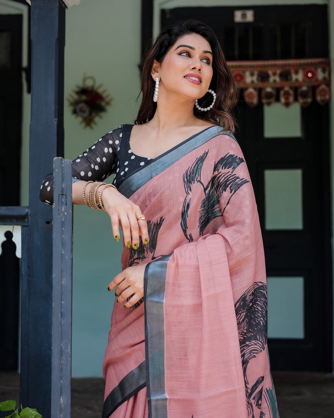 Artistic Salmon Pink Cotton Linen Saree featuring Charcoal Black Bird Sketch Illustrations, a Solid Slate Gray Border, and a Matching Polka-Dotted Blouse