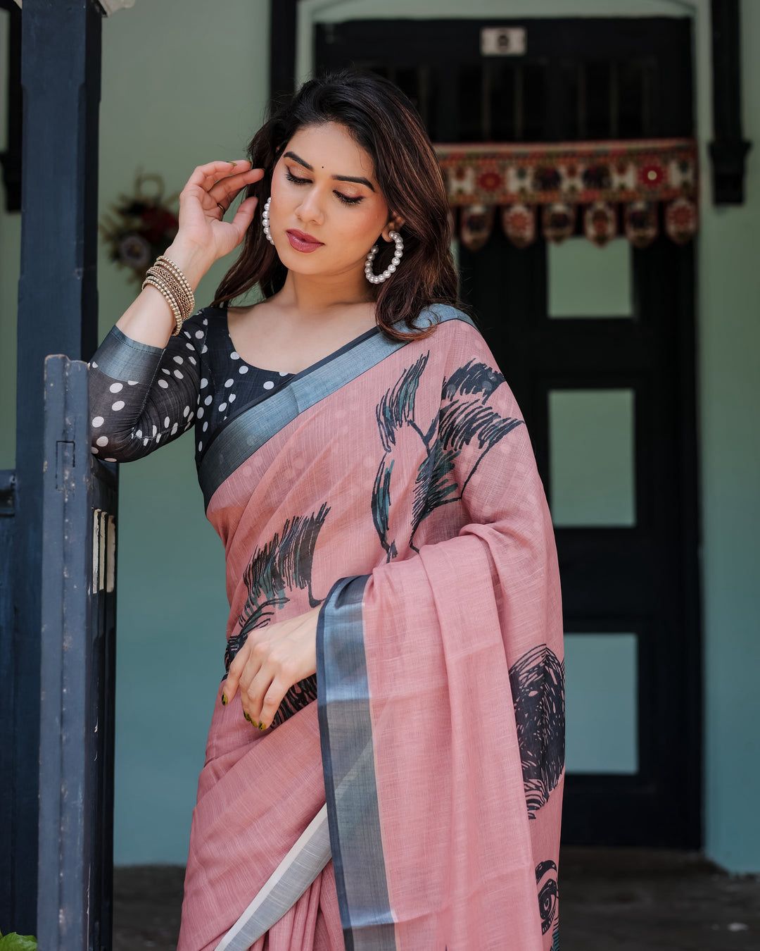 Artistic Salmon Pink Cotton Linen Saree featuring Charcoal Black Bird Sketch Illustrations, a Solid Slate Gray Border, and a Matching Polka-Dotted Blouse