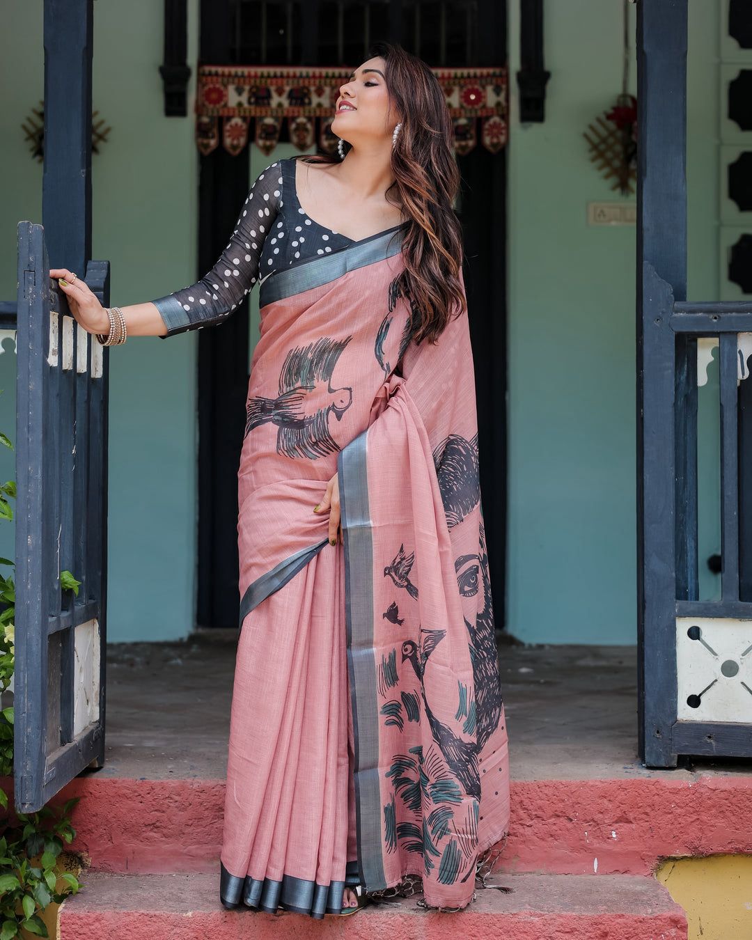Artistic Salmon Pink Cotton Linen Saree featuring Charcoal Black Bird Sketch Illustrations, a Solid Slate Gray Border, and a Matching Polka-Dotted Blouse