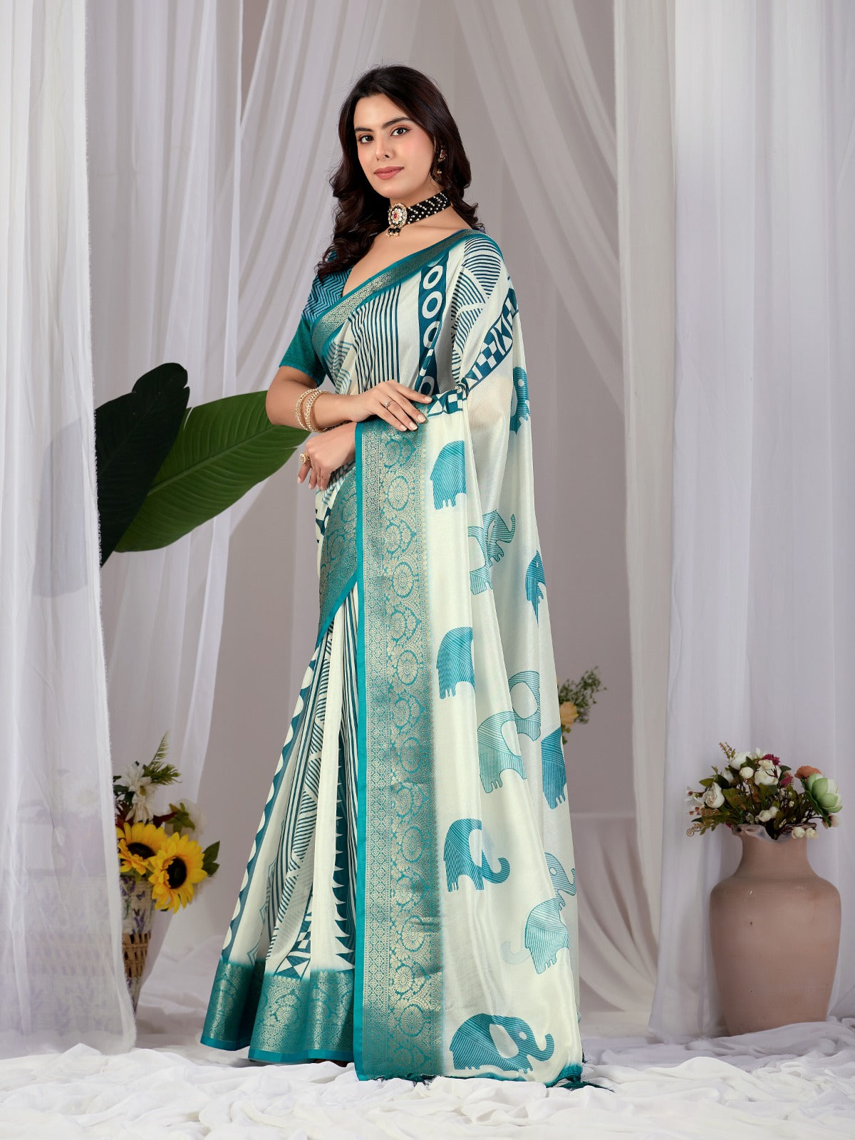 Luxury Off-White Art Silk Saree with Teal Geometric Patterns, Elephant Prints, and Zari Pallu with Tassels