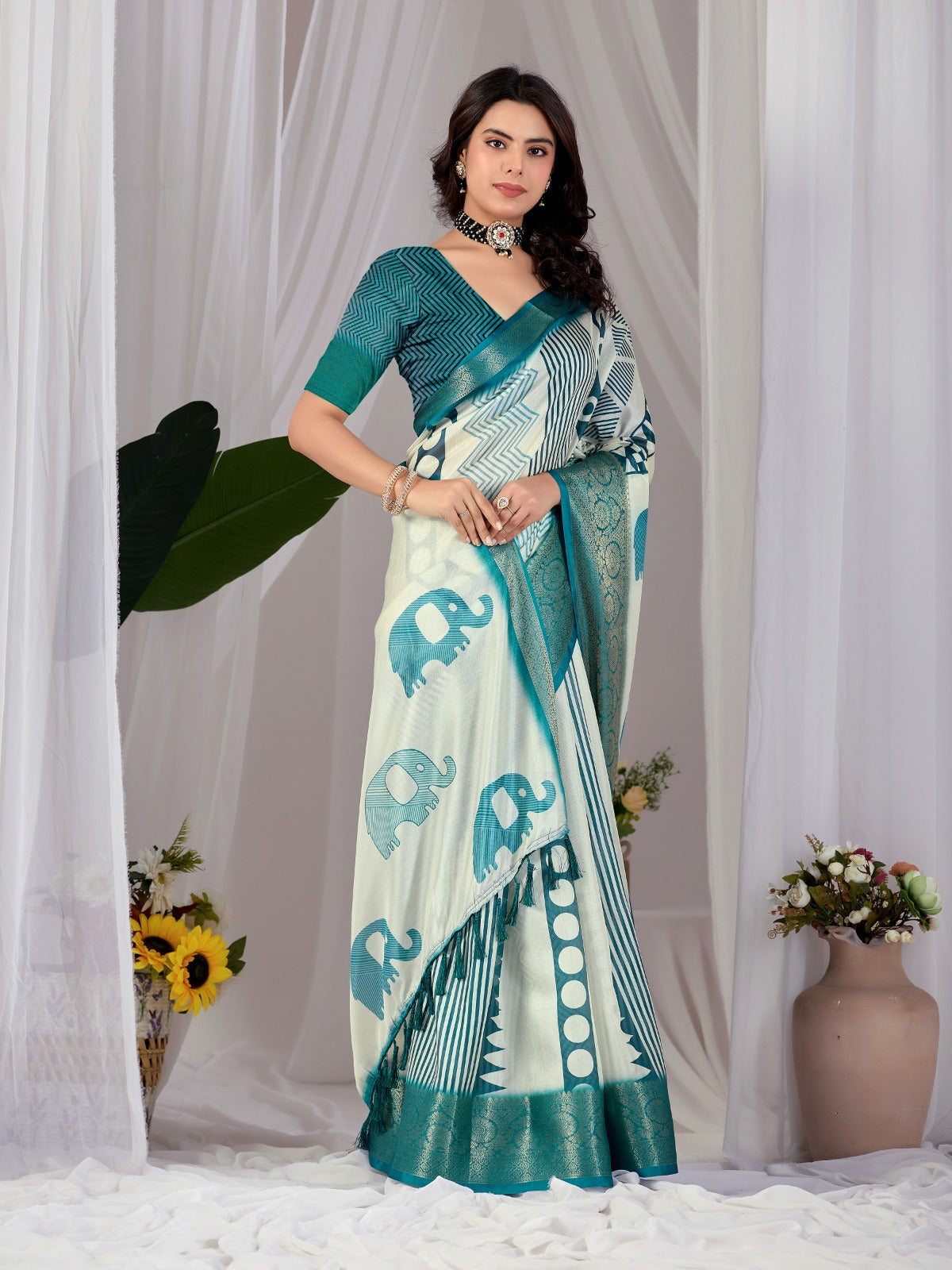 Luxury Off-White Art Silk Saree with Teal Geometric Patterns, Elephant Prints, and Zari Pallu with Tassels