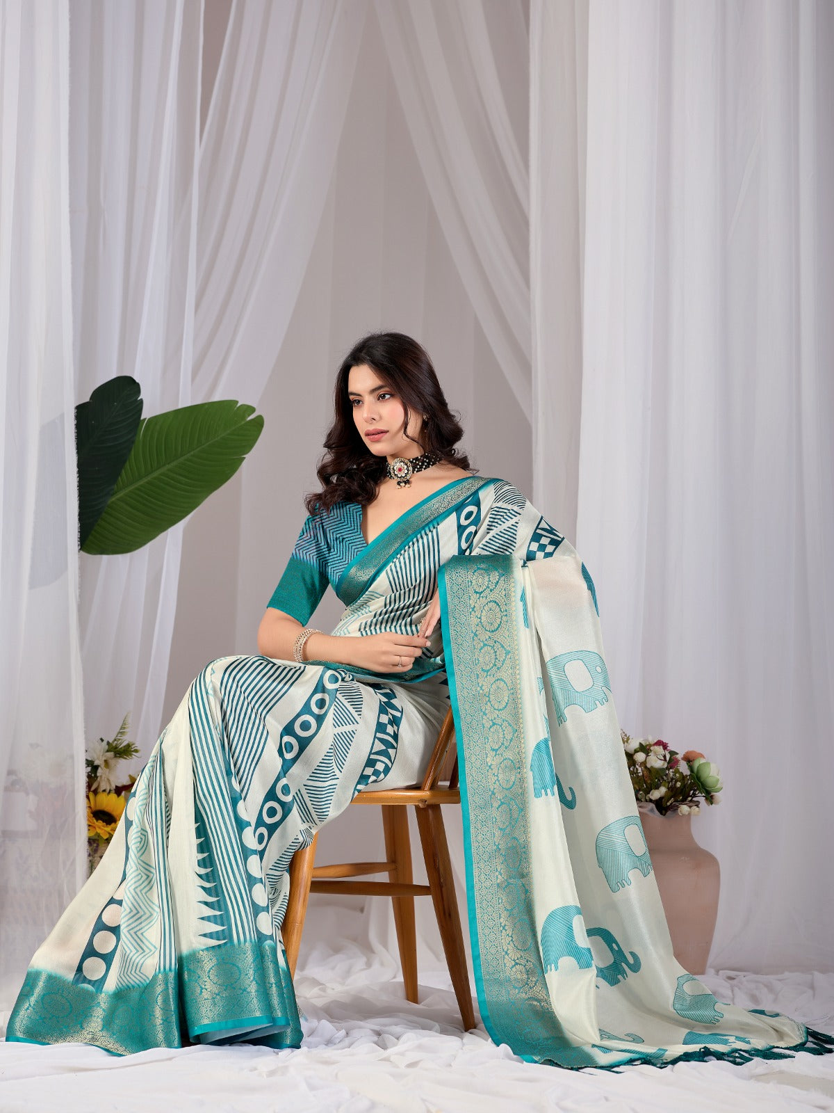 Luxury Off-White Art Silk Saree with Teal Geometric Patterns, Elephant Prints, and Zari Pallu with Tassels