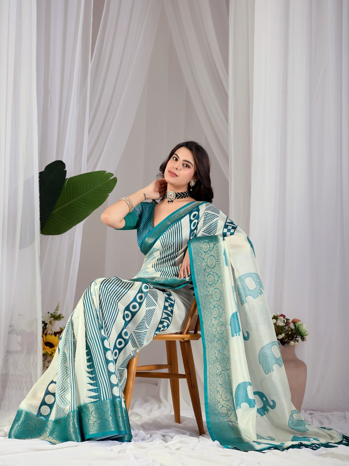 Luxury Off-White Art Silk Saree with Teal Geometric Patterns, Elephant Prints, and Zari Pallu with Tassels