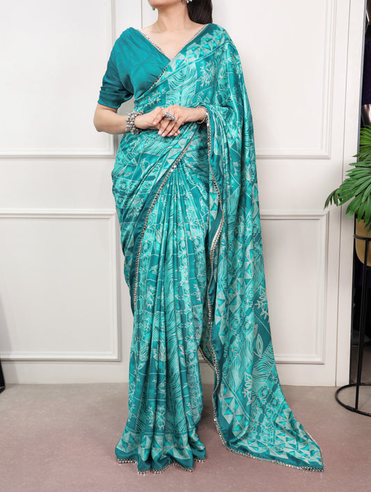 Delicate mirror lace detailing, this saree is the perfect blend of tradition and festive sparkle.