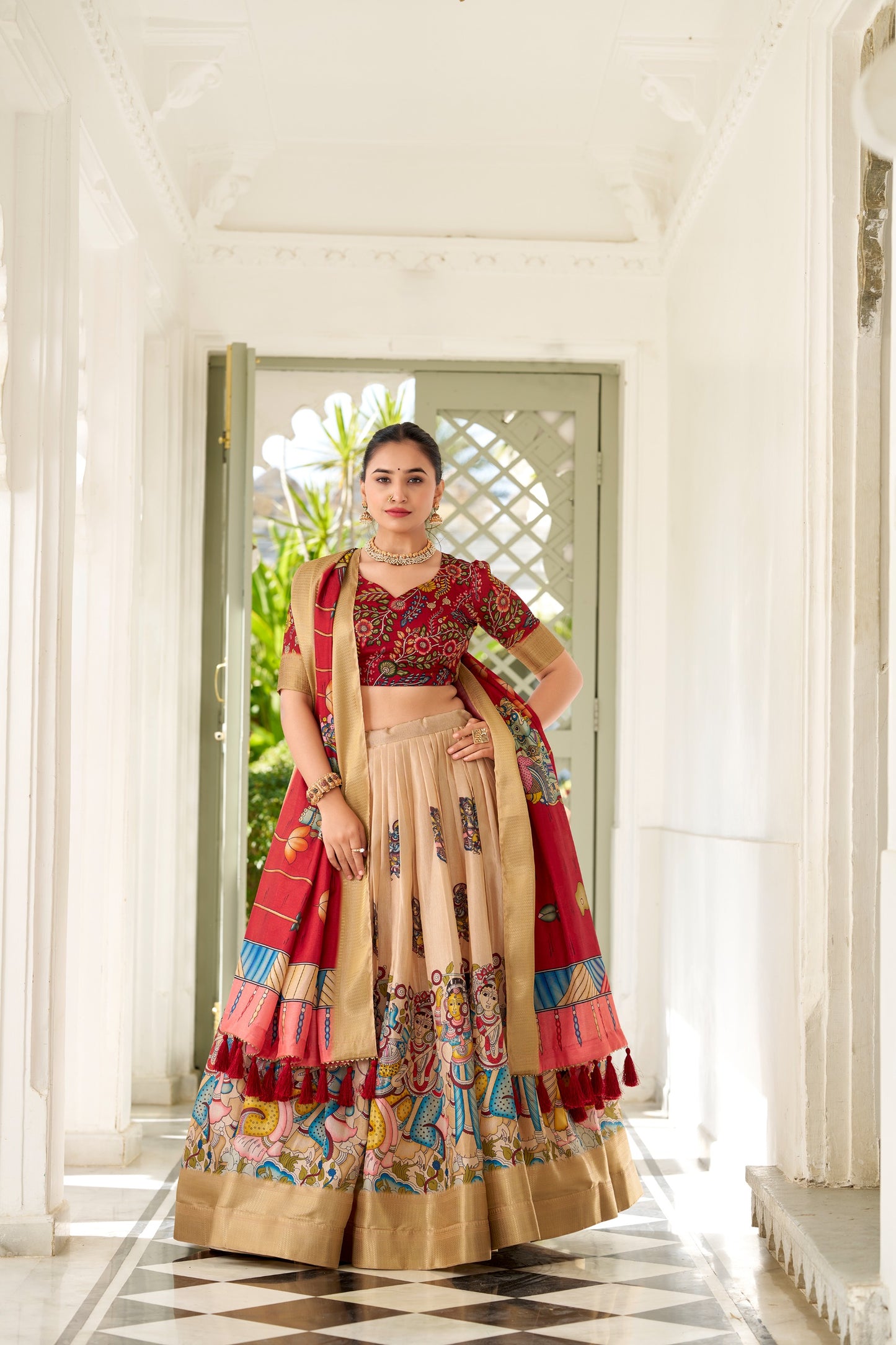 Adorned in the elegance of Dola Silk and the intricate charm of Kalamkari prints, the lehenga choli whispers tales of tradition and beauty💐.