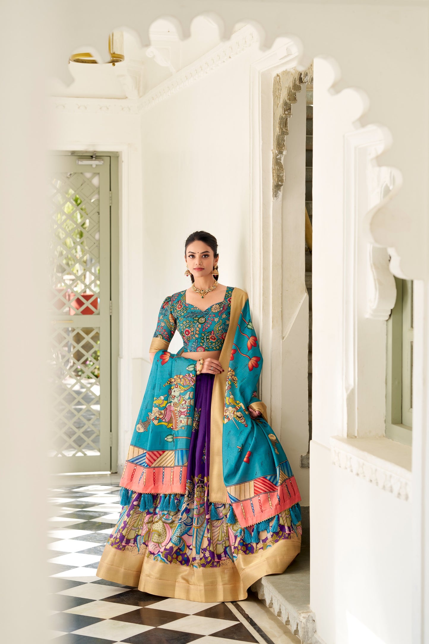 Adorned in the elegance of Dola Silk and the intricate charm of Kalamkari prints, the lehenga choli whispers tales of tradition and beauty💐.