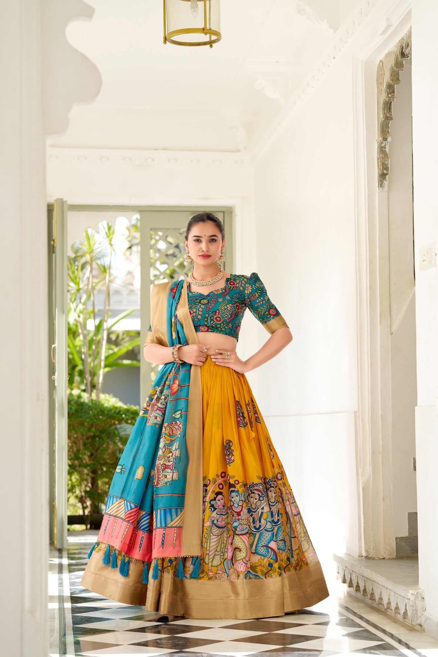 Adorned in the elegance of Dola Silk and the intricate charm of Kalamkari prints, the lehenga choli whispers tales of tradition and beauty💐.