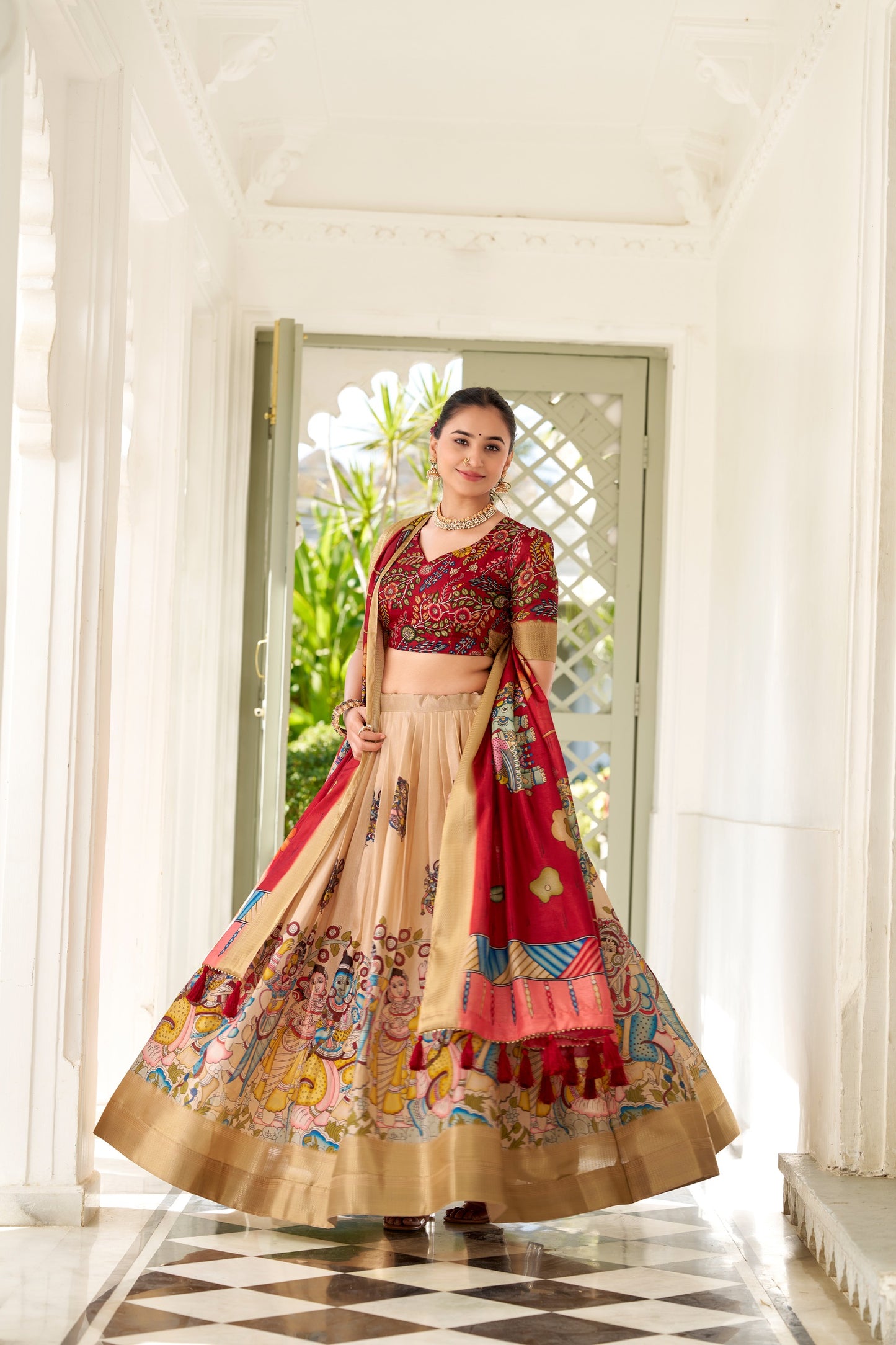Adorned in the elegance of Dola Silk and the intricate charm of Kalamkari prints, the lehenga choli whispers tales of tradition and beauty💐.