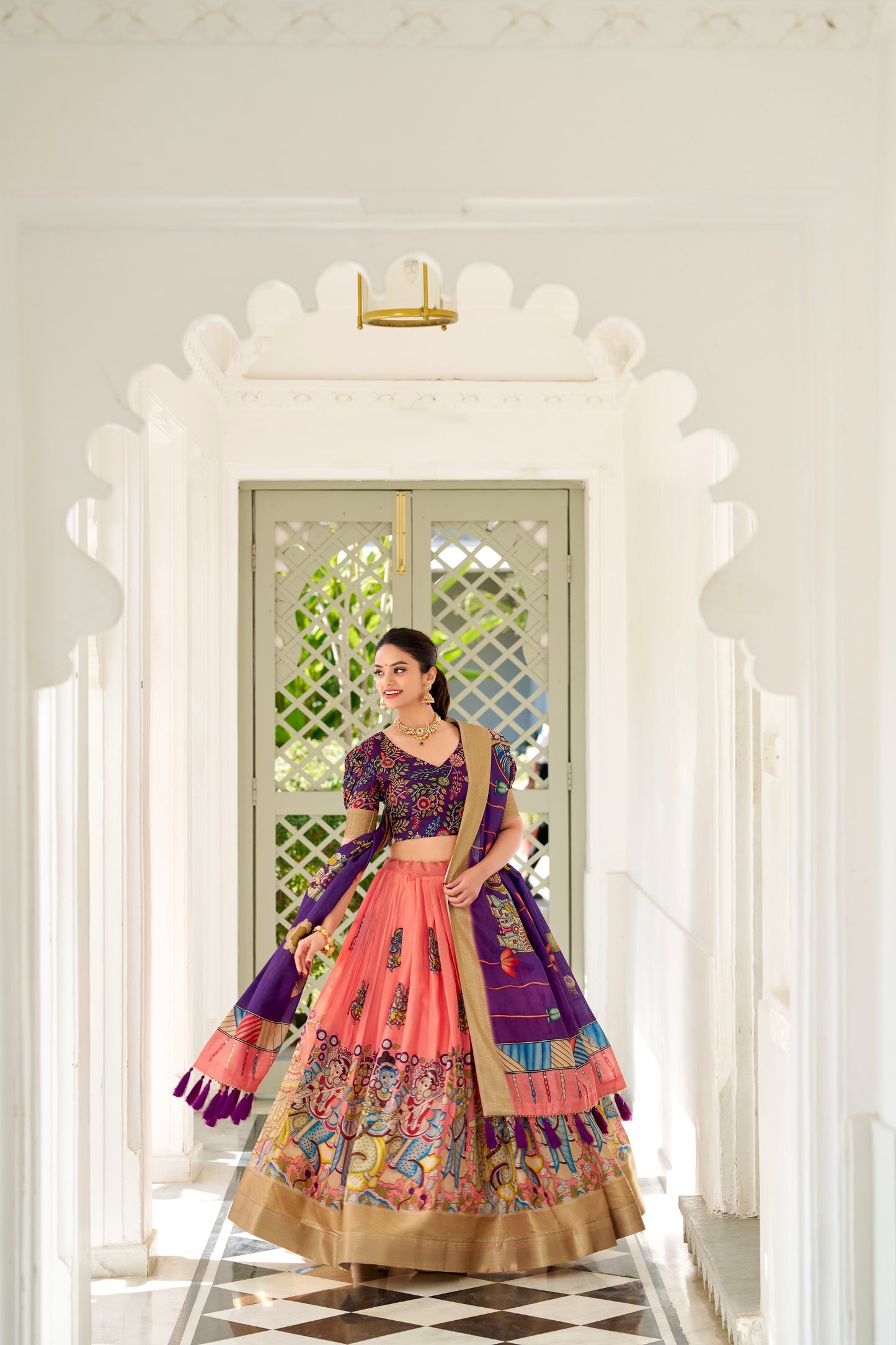 Adorned in the elegance of Dola Silk and the intricate charm of Kalamkari prints, the lehenga choli whispers tales of tradition and beauty💐.
