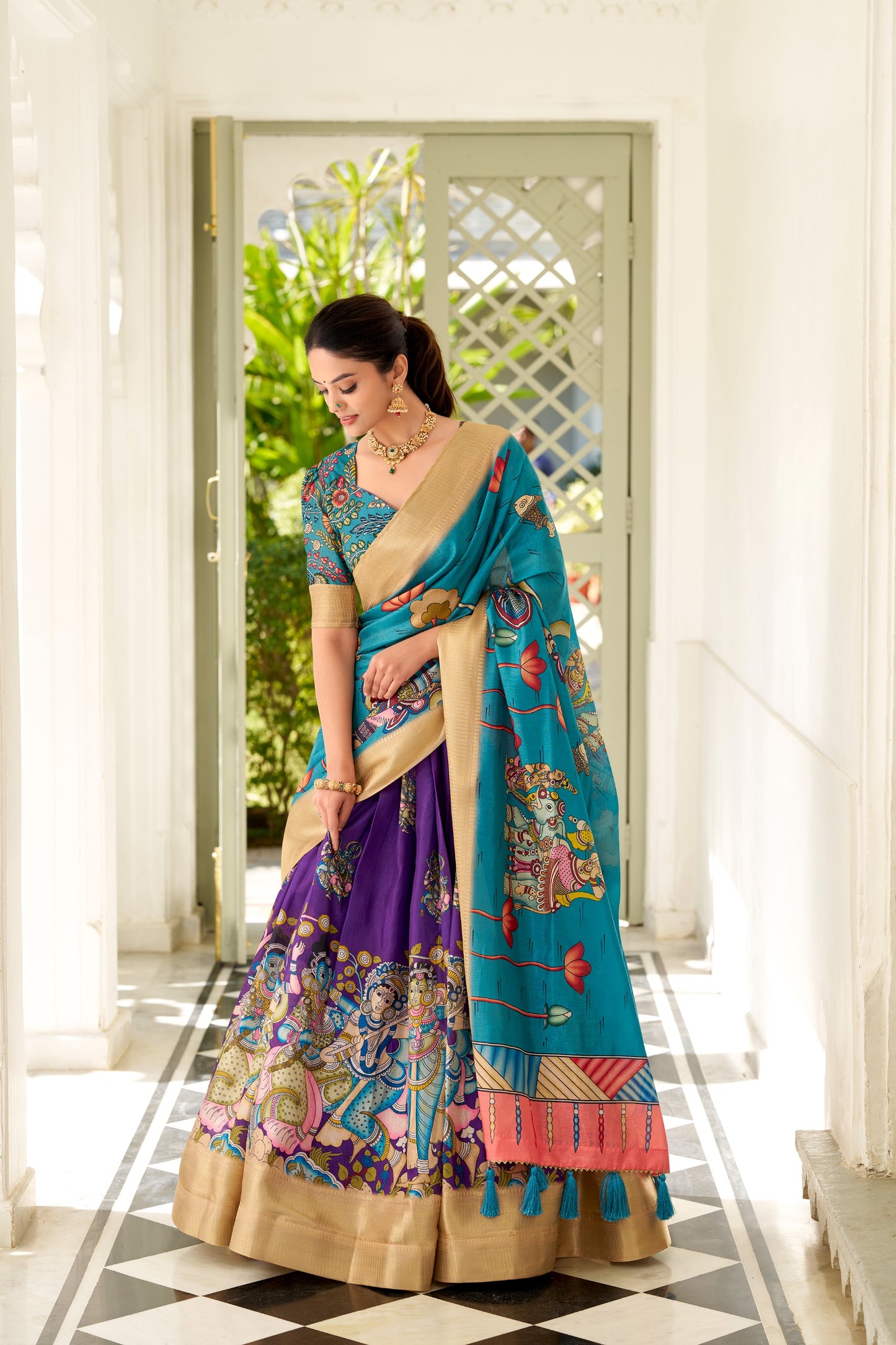 Adorned in the elegance of Dola Silk and the intricate charm of Kalamkari prints, the lehenga choli whispers tales of tradition and beauty💐.