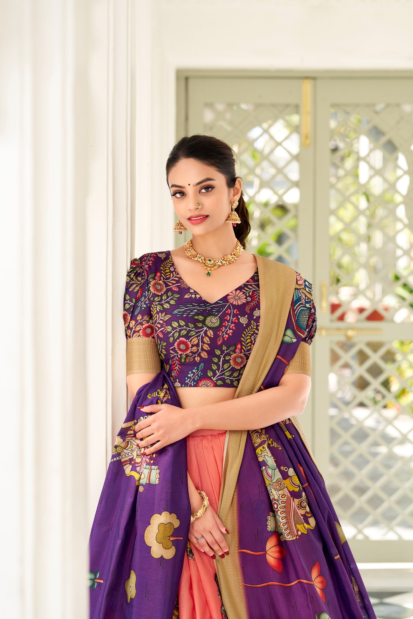 Adorned in the elegance of Dola Silk and the intricate charm of Kalamkari prints, the lehenga choli whispers tales of tradition and beauty💐.