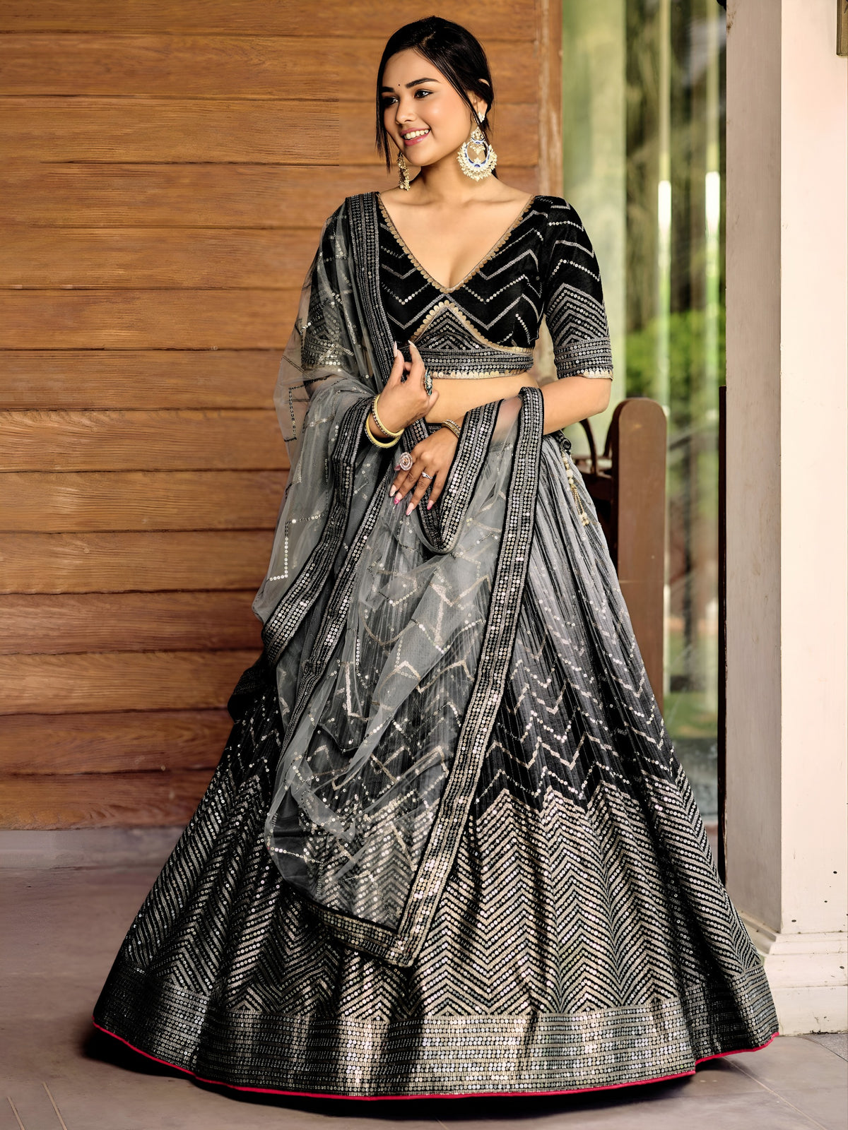 Women's Lehenga Choli in Black Chinnon with Thread and Sequins Embroidery