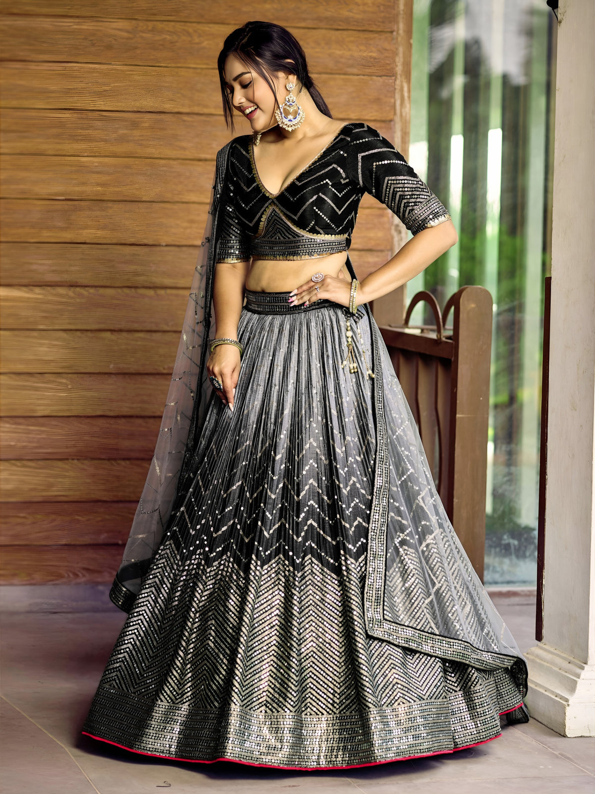 Women's Lehenga Choli in Black Chinnon with Thread and Sequins Embroidery